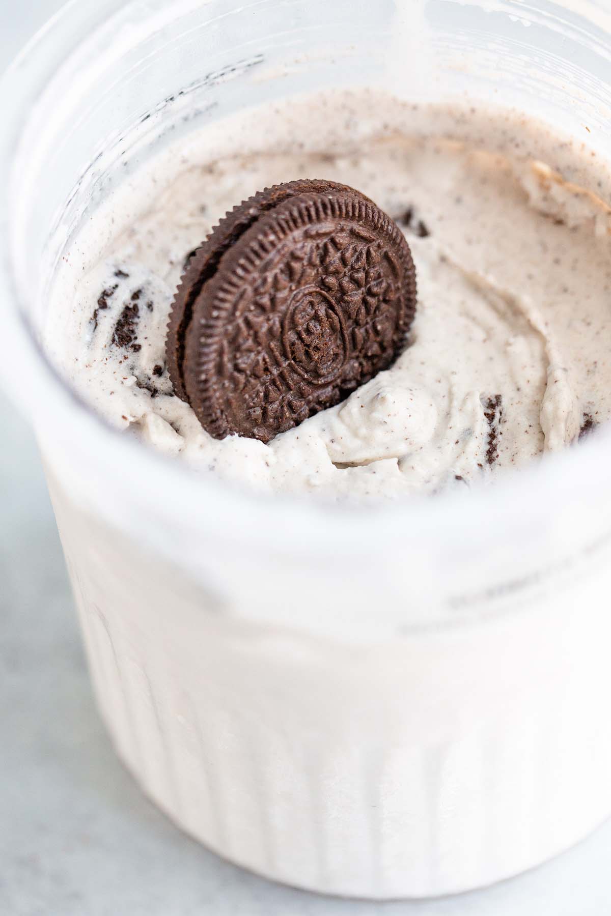 Ninja Creami cookies and cream ice cream with an oreo on top.