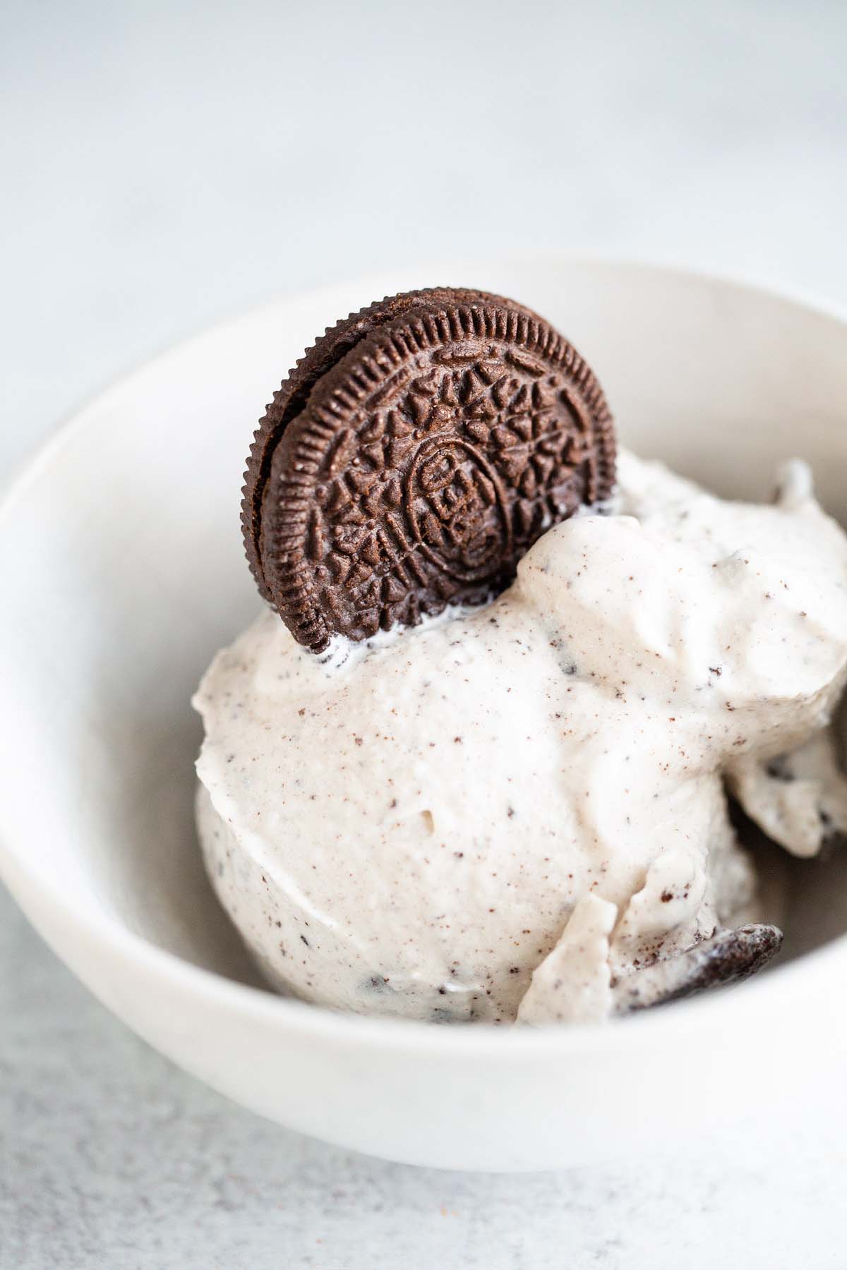 Ninja Creami cookies and cream ice cream with an oreo on top.