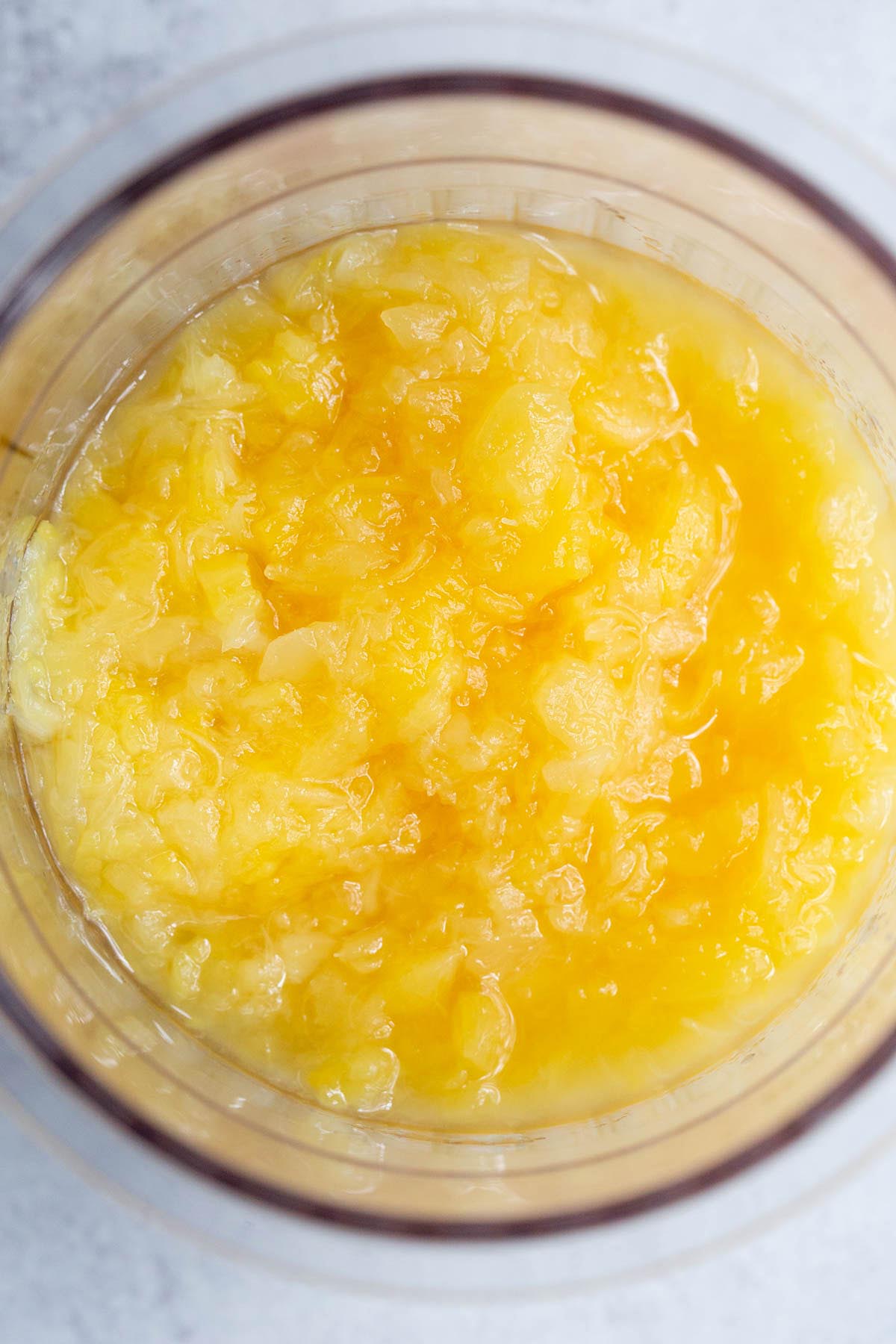 Crushed pineapple in ninja creami container