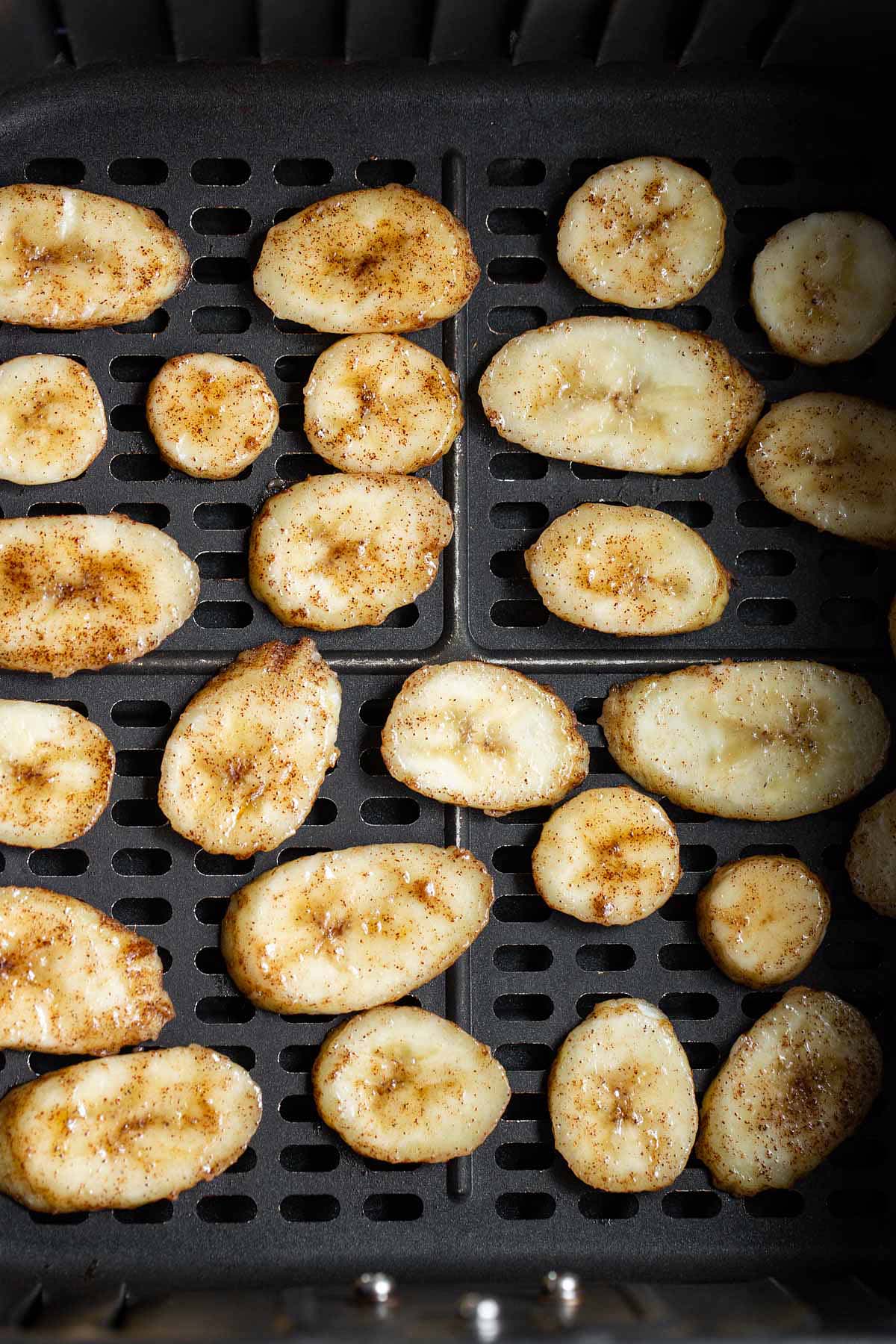 Banana slices in air fryer basket