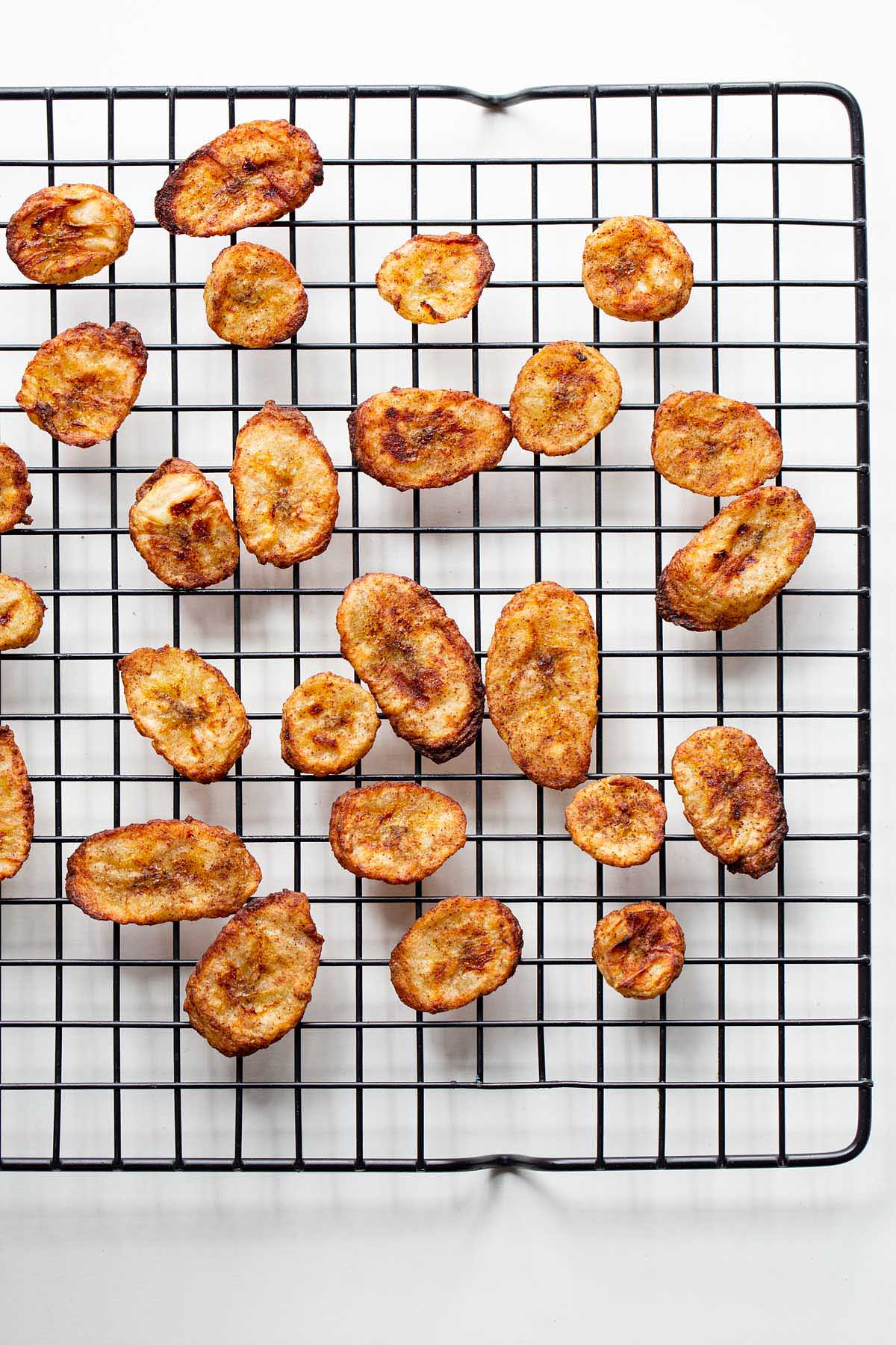 Air fryer banana chips on a cooling tray