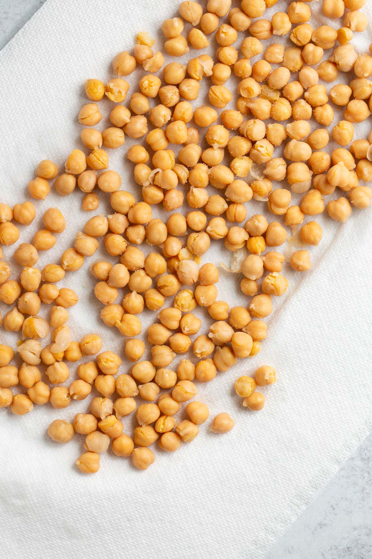 Chickpeas drying on a paper towel