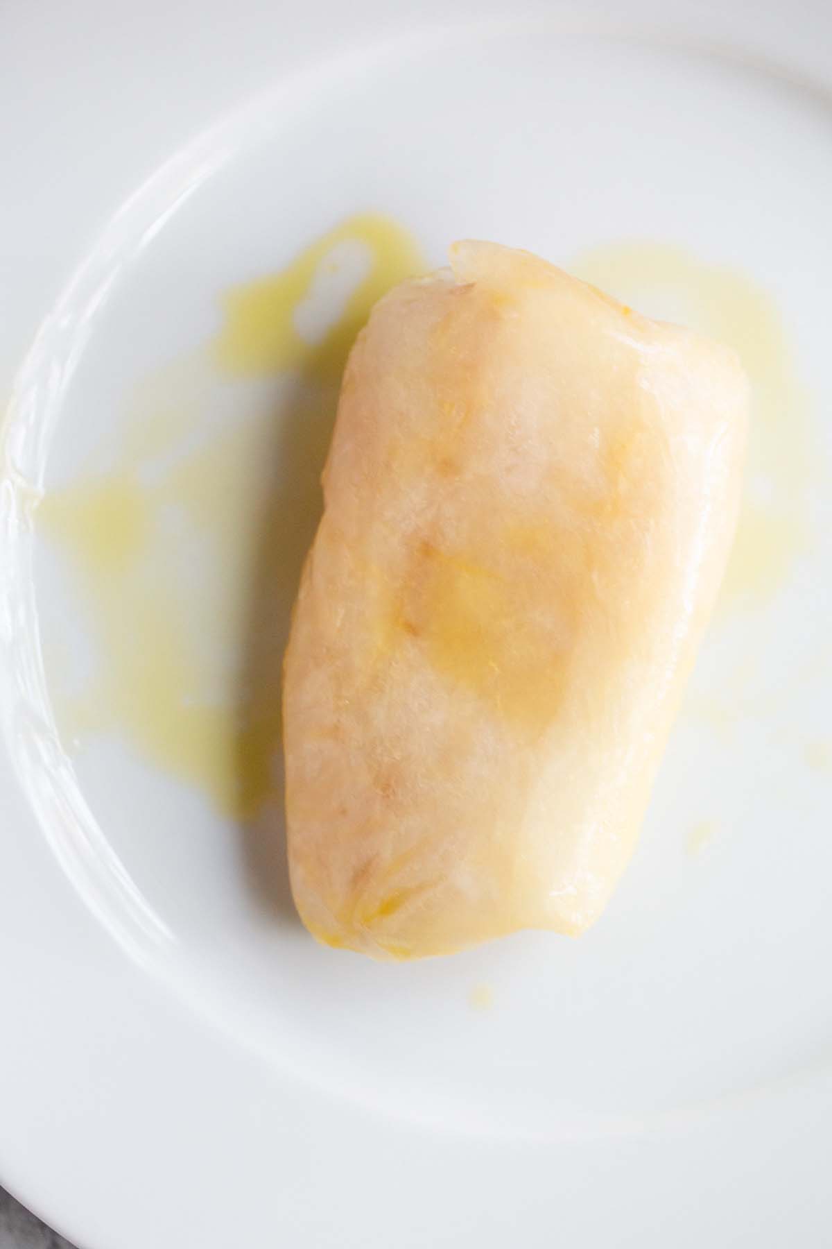 Olive oil drizzled on frozen cod