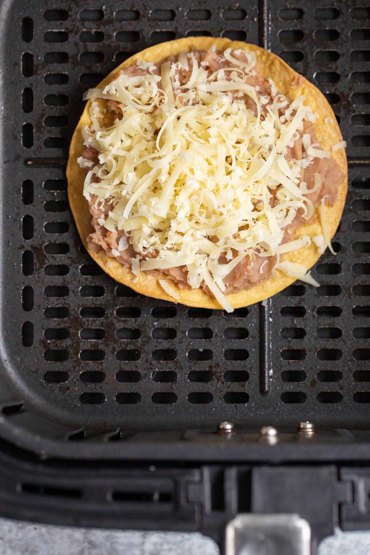 Air fried tostada with beans and cheese