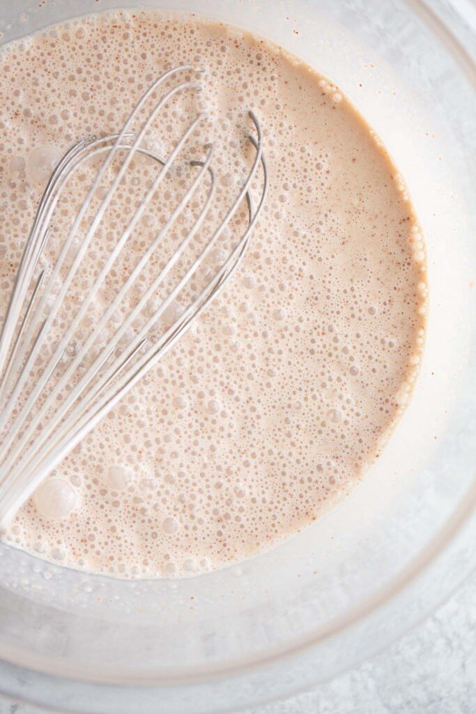 Mixing together chocolate peanut butter creami