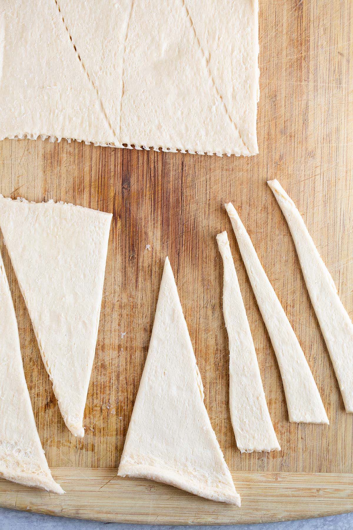 Rolling out and cutting crescent roll dough