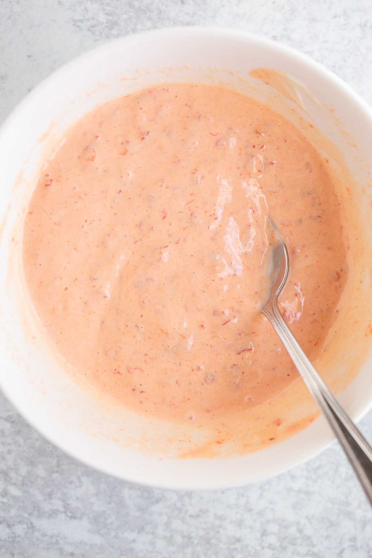 Harissa mayo in a white bowl