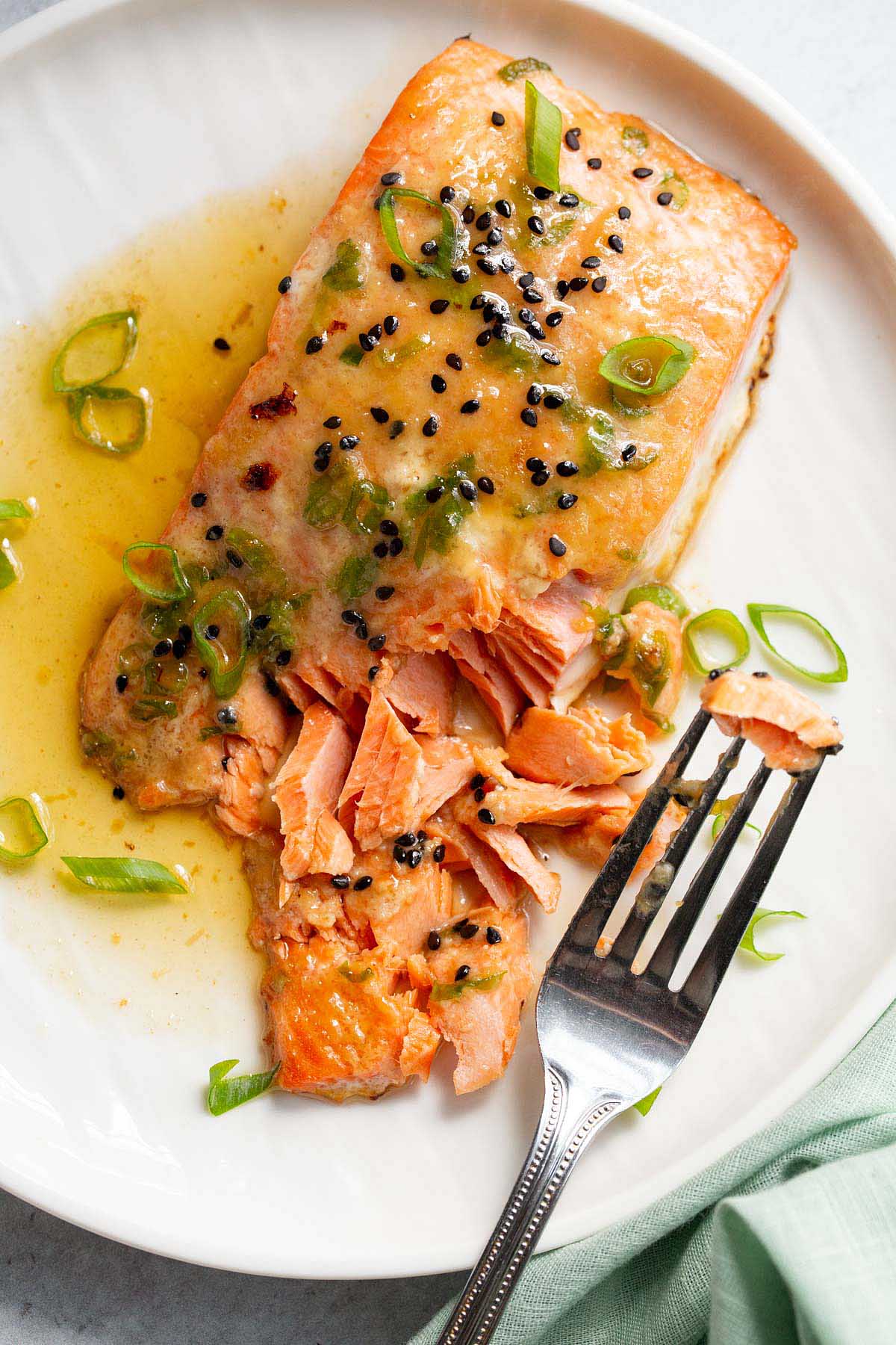 Miso butter salmon flaked with a fork