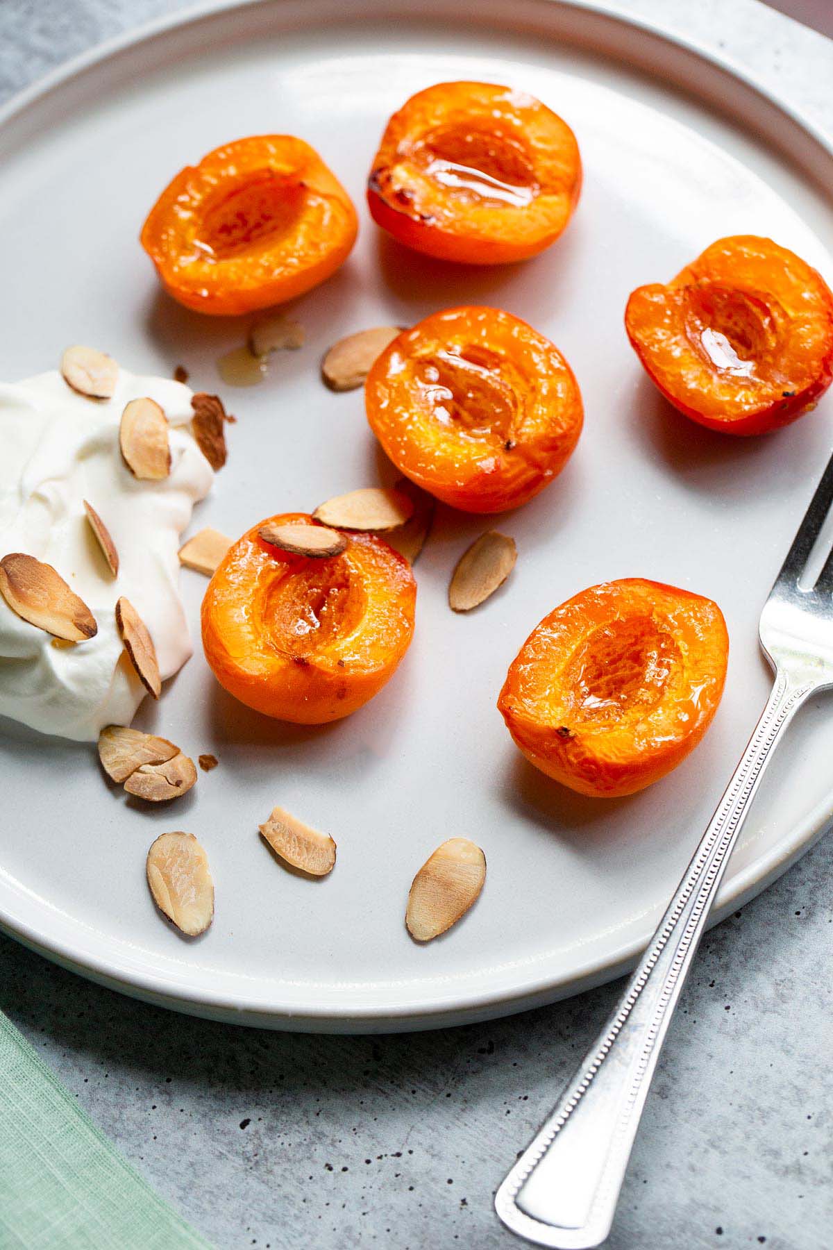 Air fried apricots on a plate.
