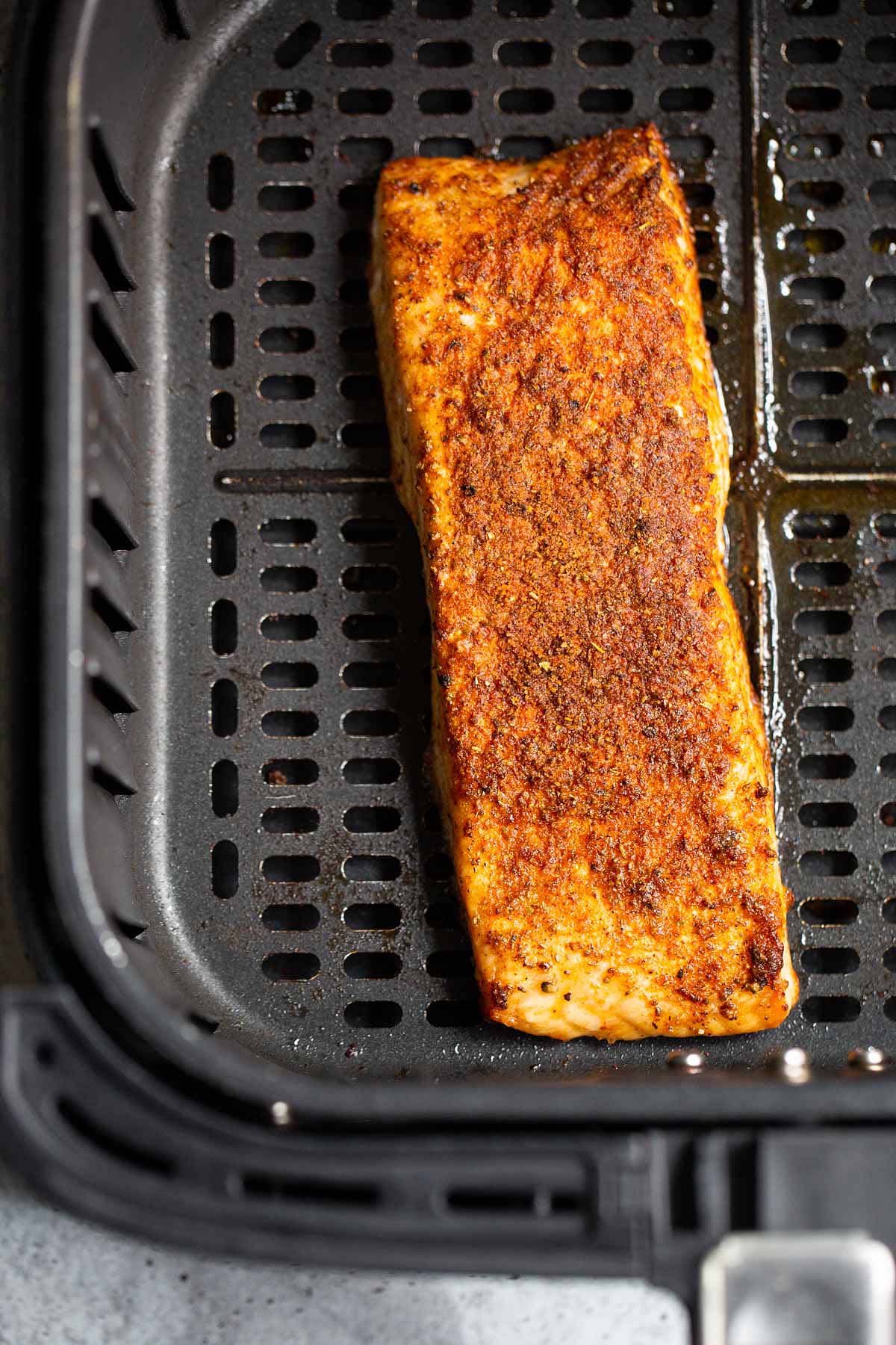 Old bay salmon in air fryer basket