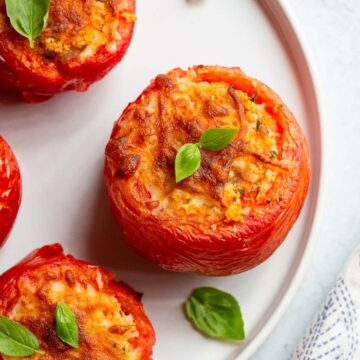 Air fryer stuffed tomatoes on a plate.