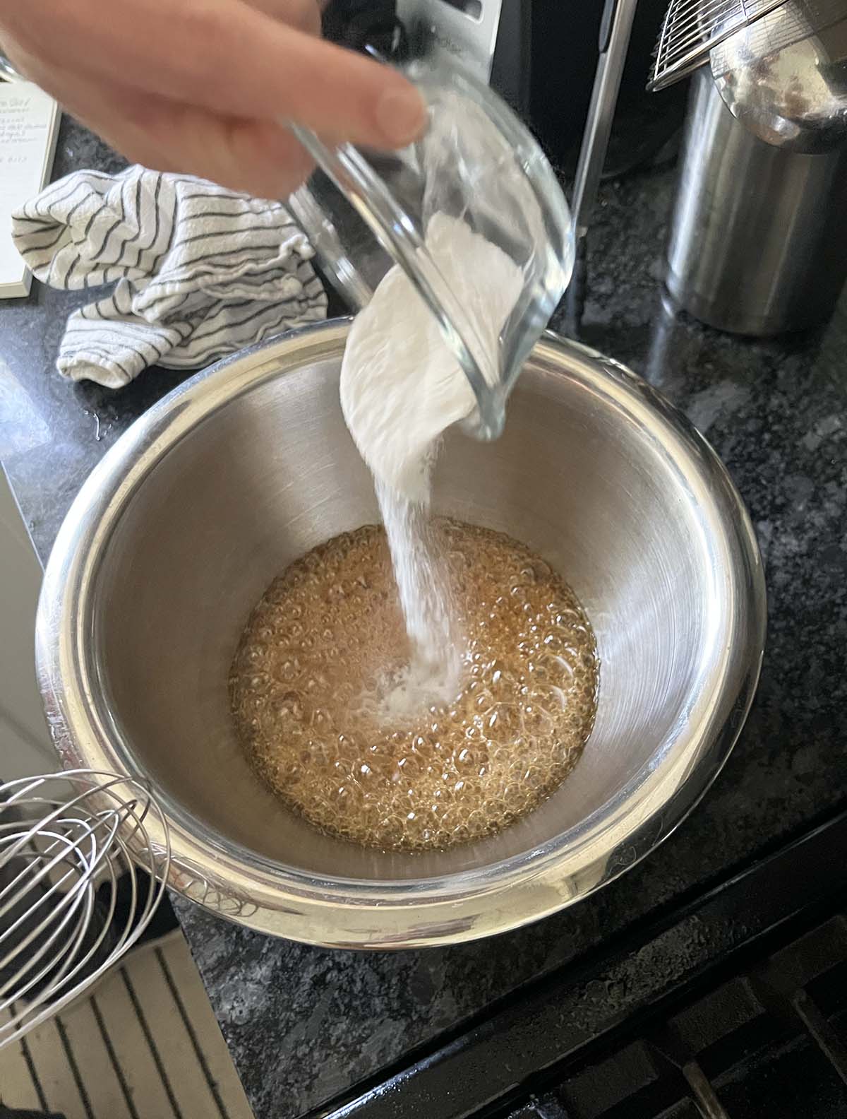 Adding baking soda to honey mixture