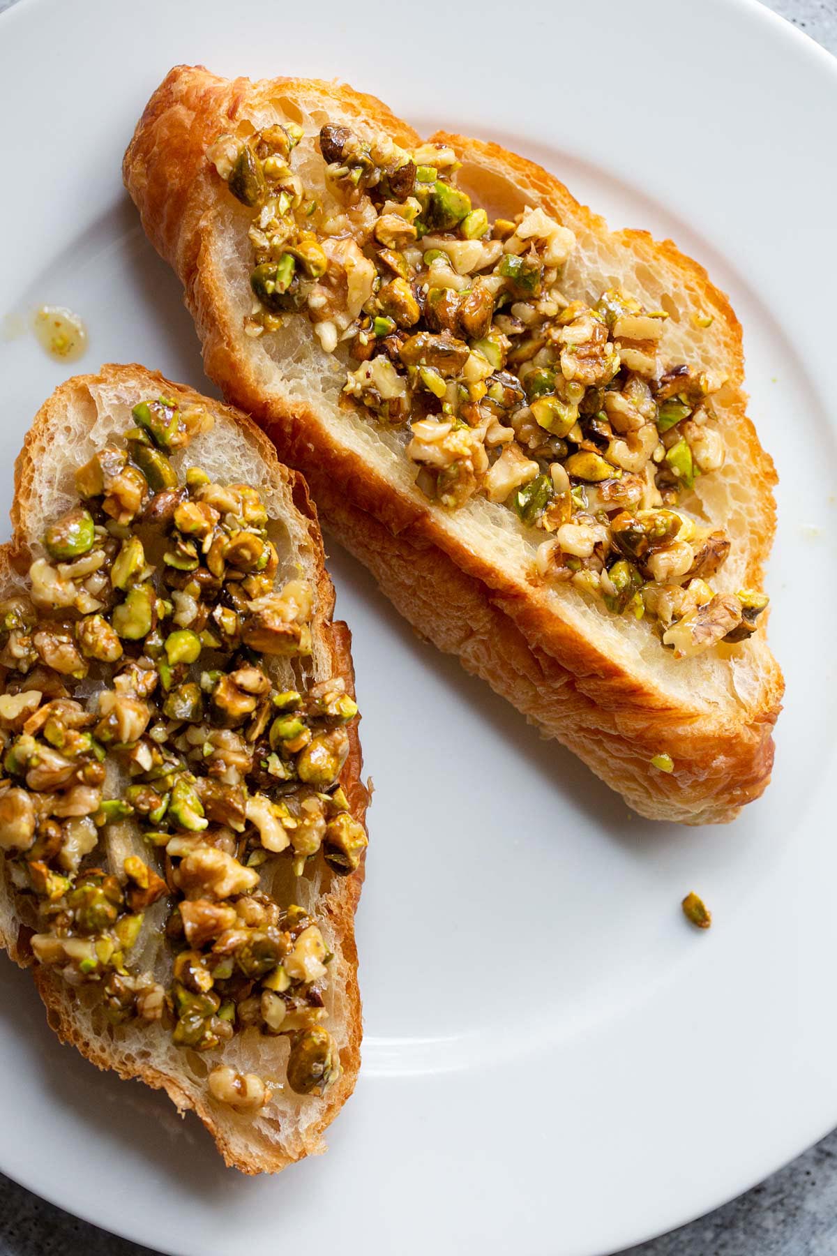 Pistachio mixture spread on croissant