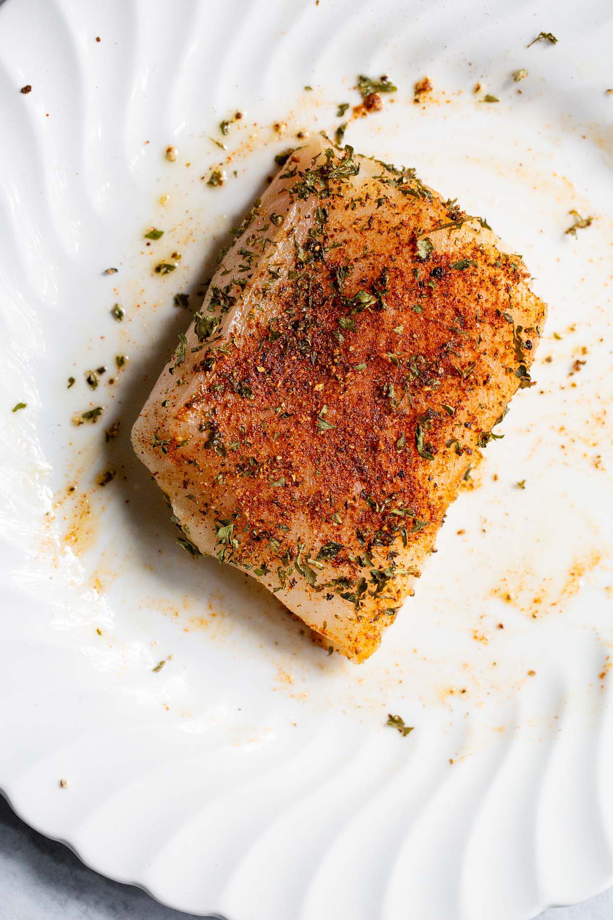 Seasoned cod on a plate
