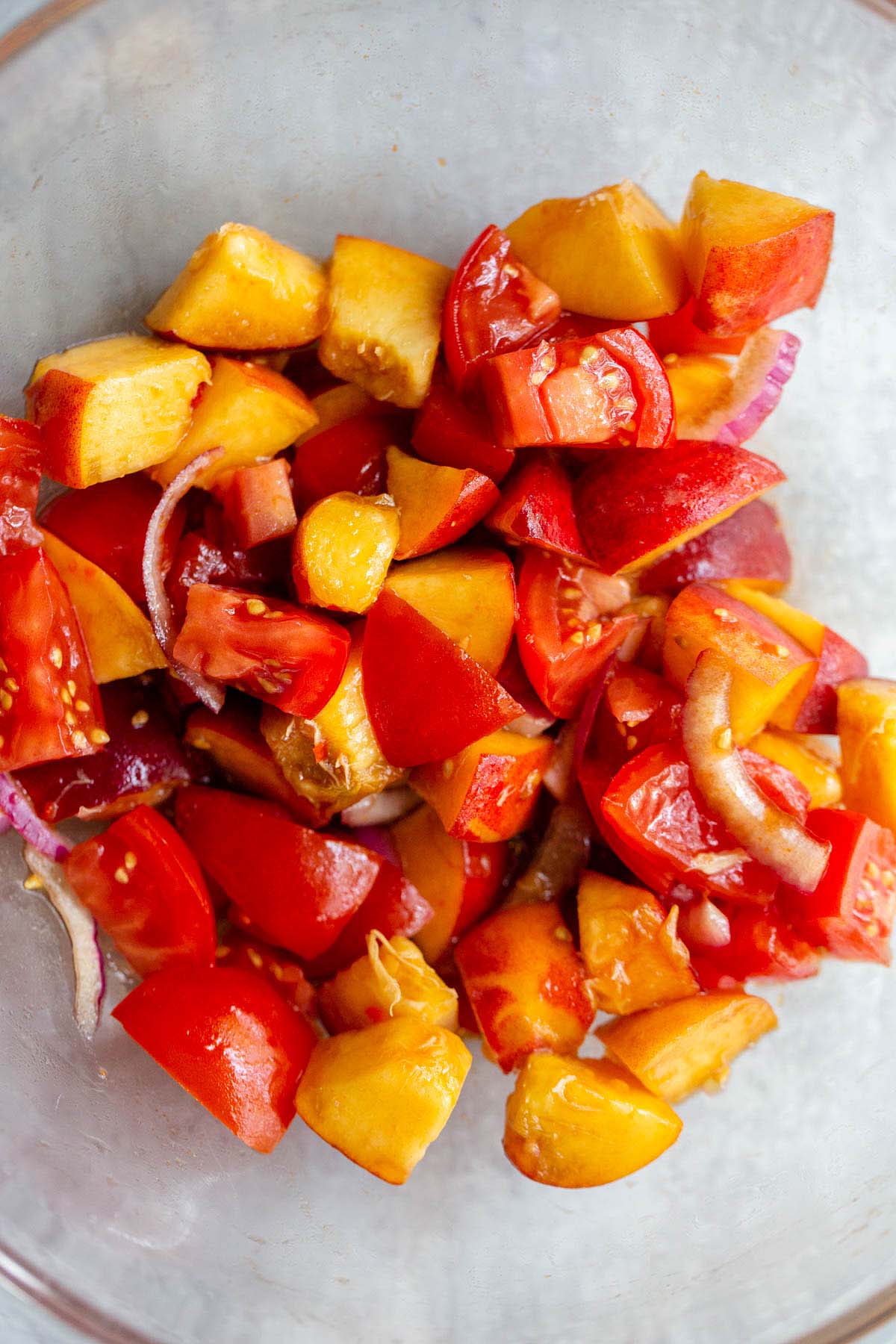 Mixing together the peach salad