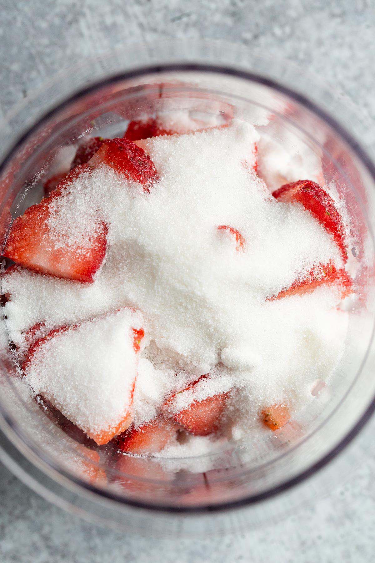 Adding sugar to strawberries
