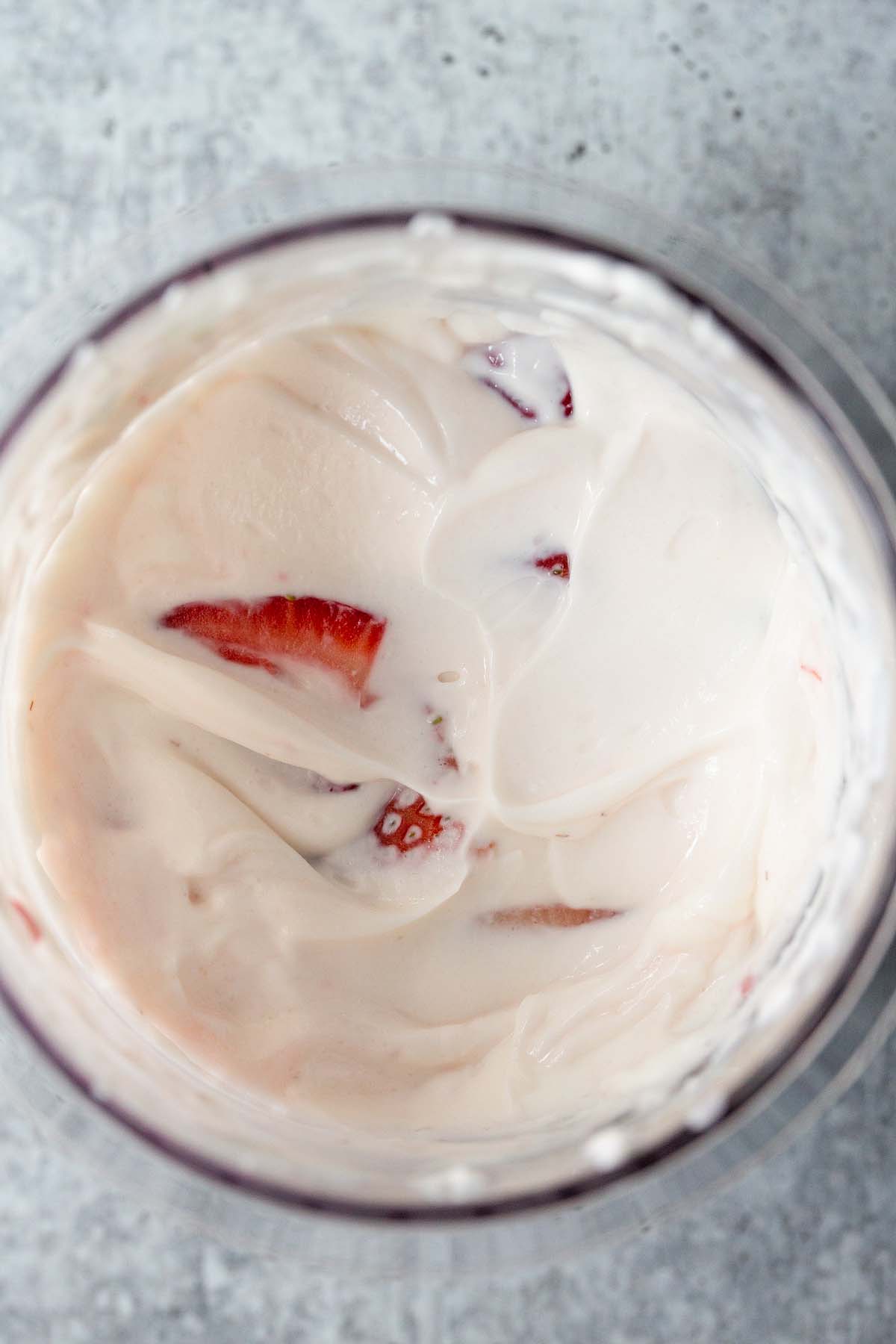 Unfrozen strawberry yogurt creami in creami container