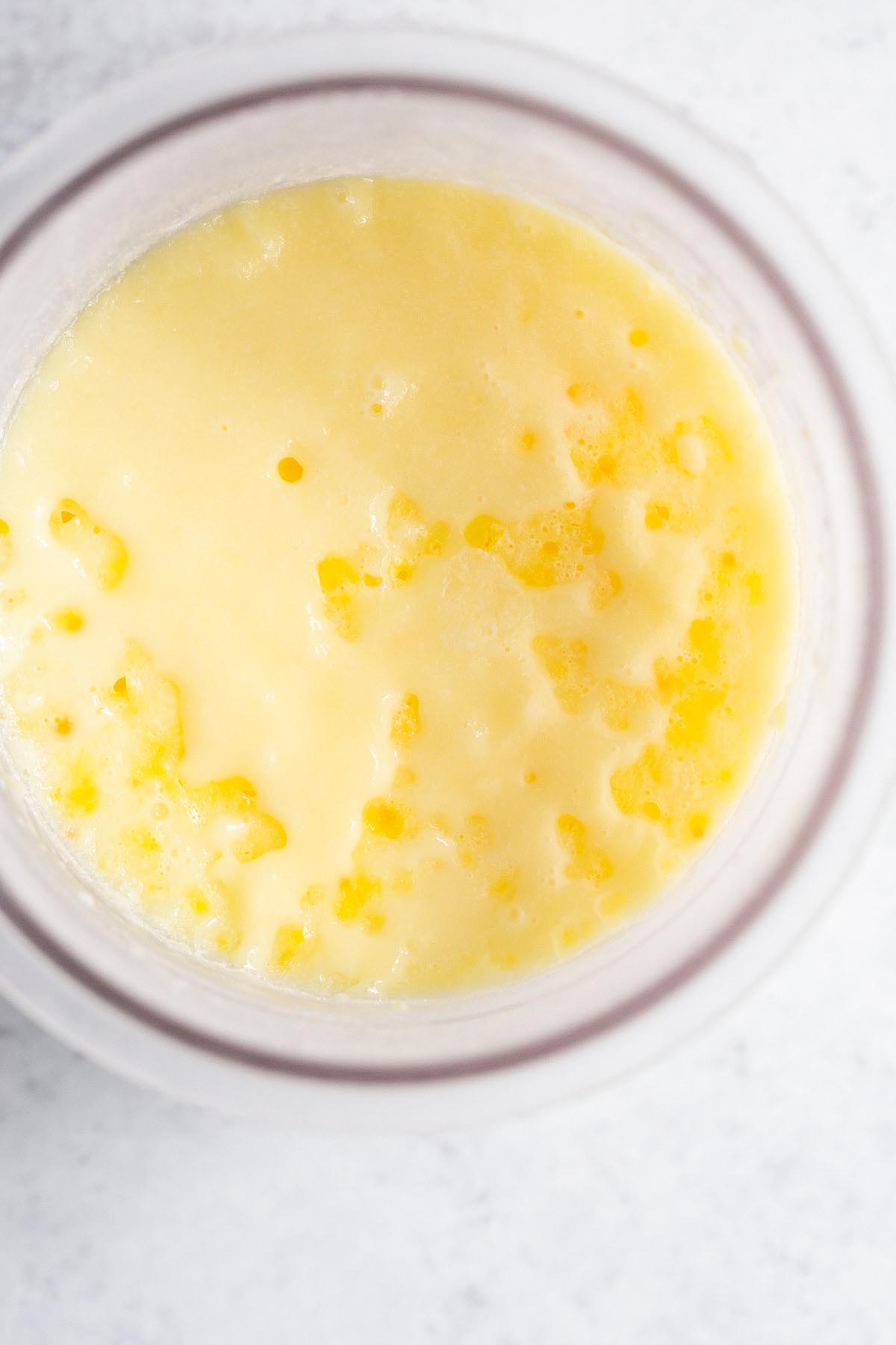 Frozen lemon ice cream in Ninja Creami pint