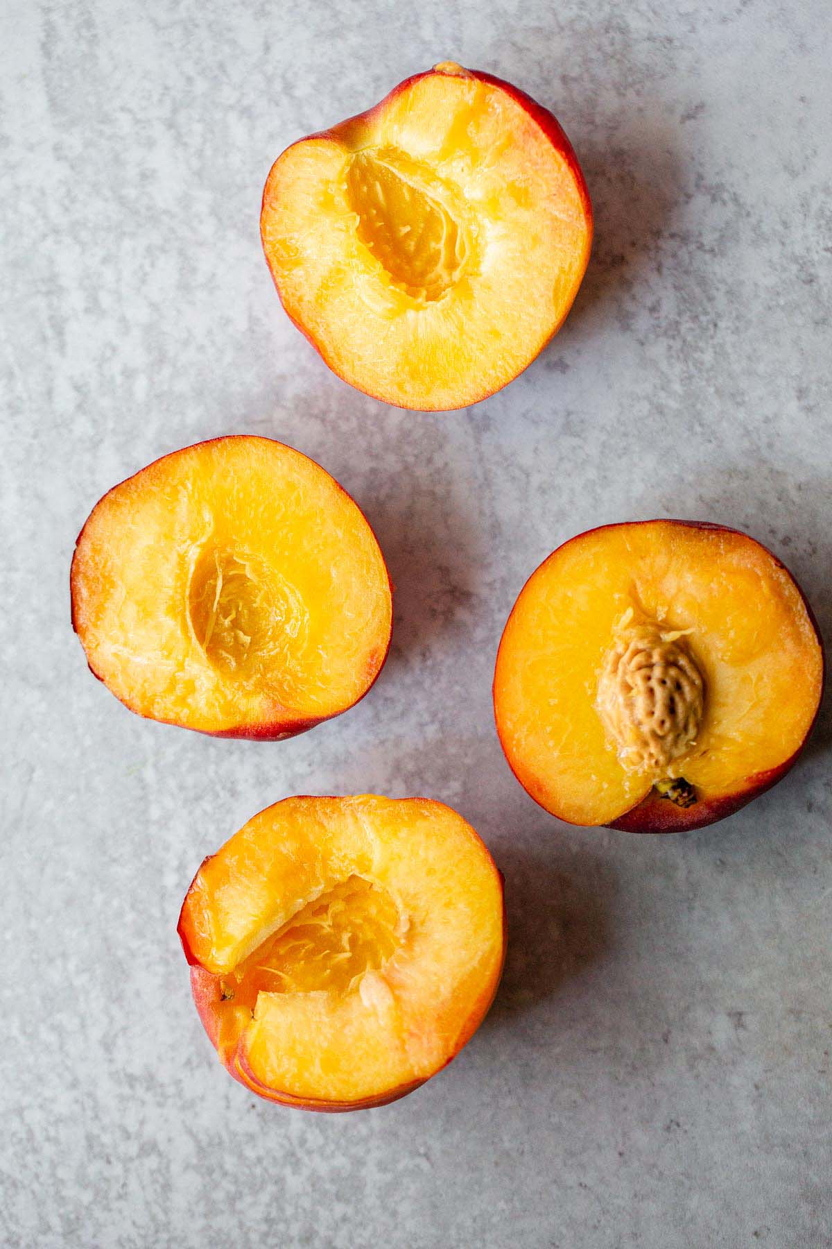 Peaches sliced in half