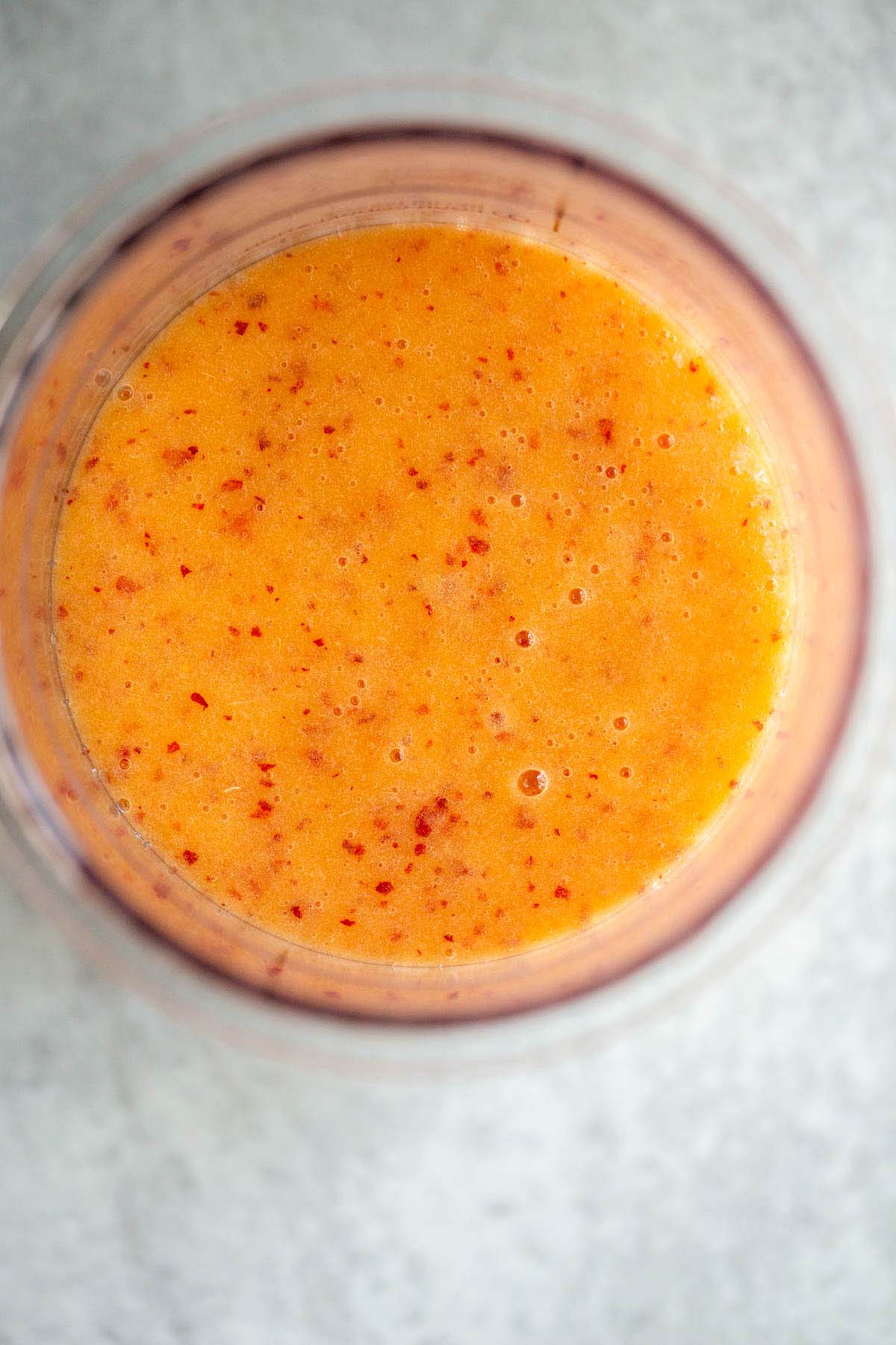 Peach sorbet mixture in Creami container