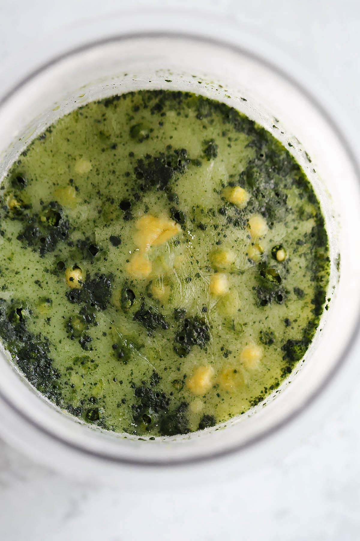 Frozen matcha ice cream in Ninja Creami pint