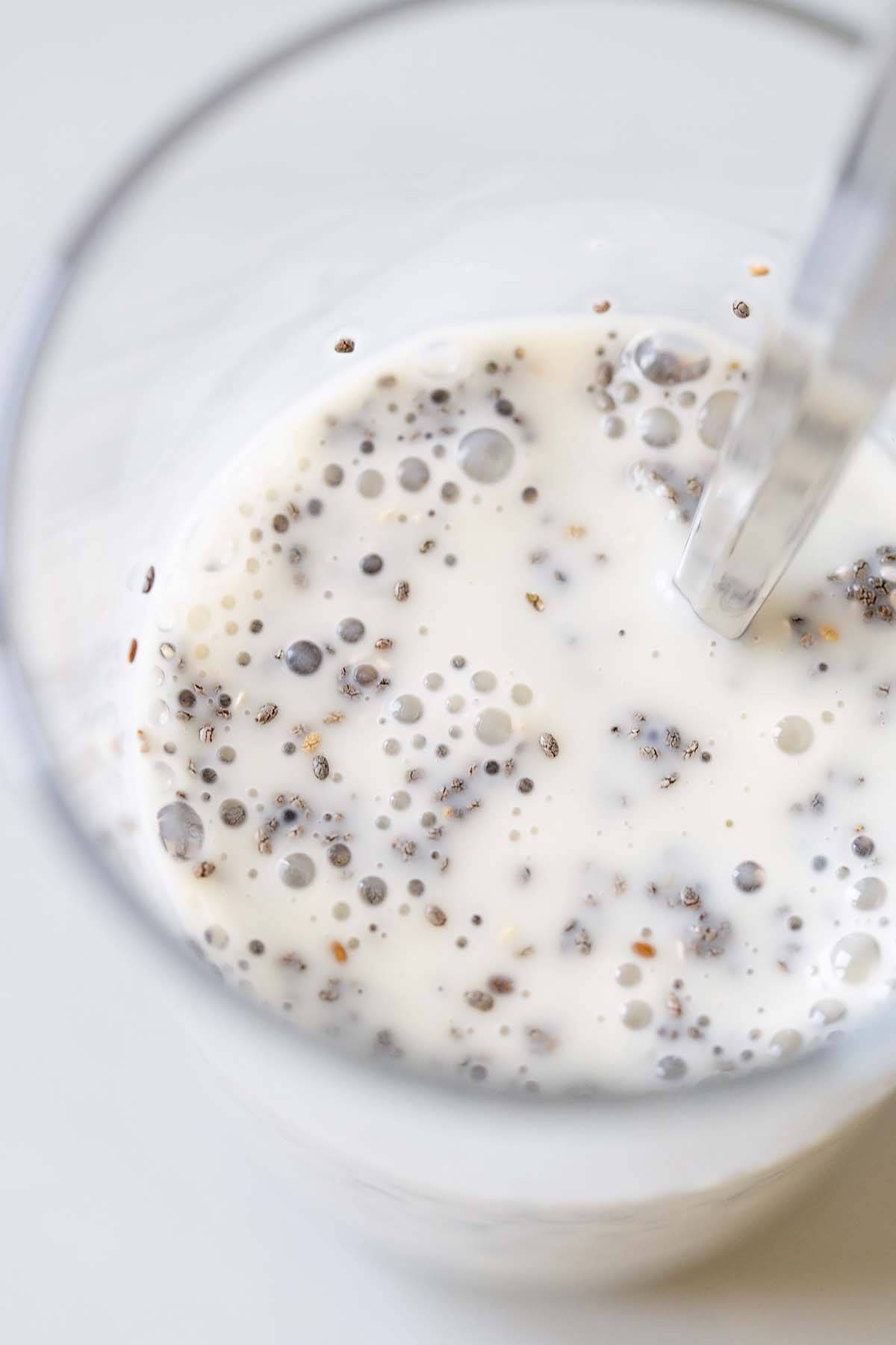 Mixing together chia seeds and milk.
