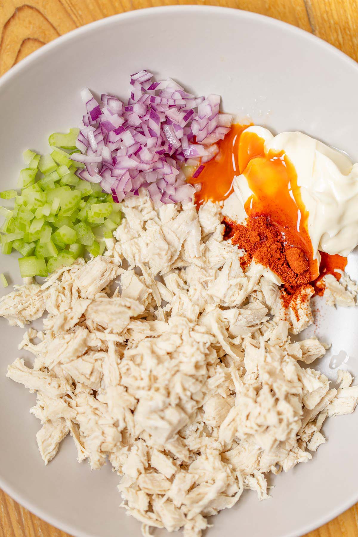Peri peri chicken salad ingredients in a bowl
