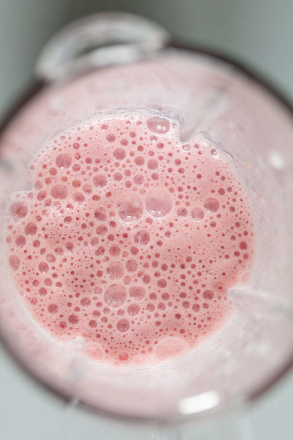 Strawberries, milk, and vanilla blended together.