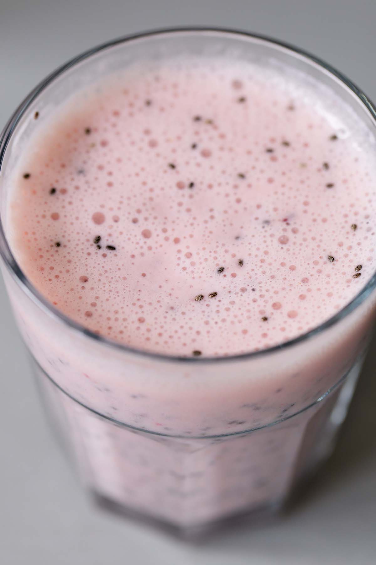 Mixing together strawberry chia pudding.