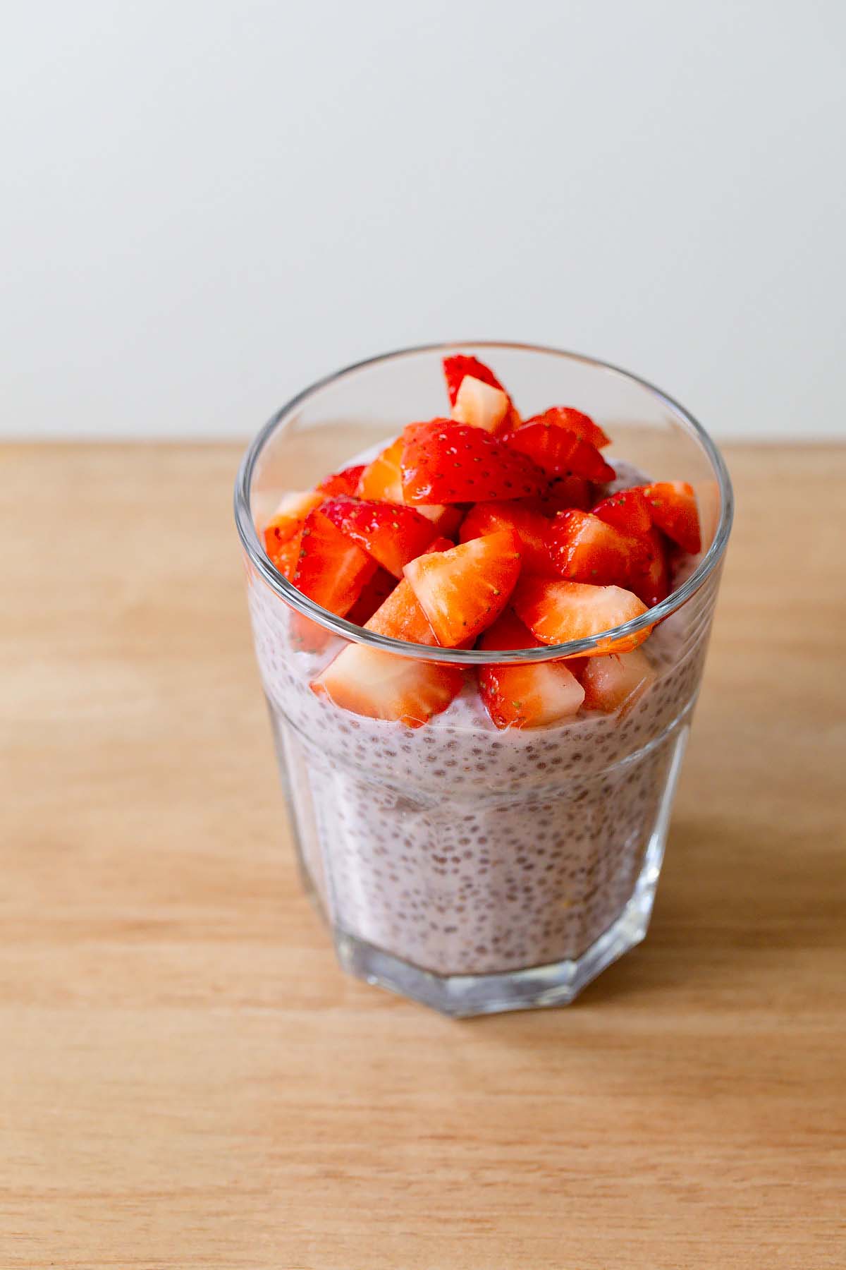 Strawberry chia pudding topped with fresh strawberries.