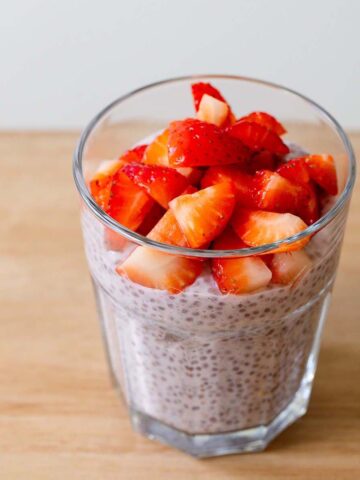 Strawberry chia pudding topped with fresh strawberries.