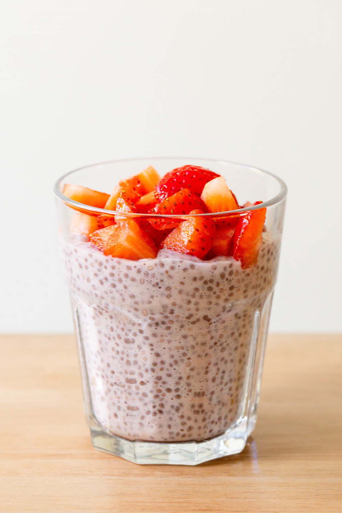 Strawberry chia pudding topped with fresh strawberries.