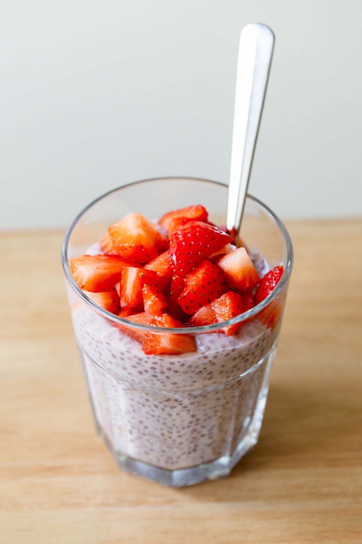 Strawberry chia pudding topped with fresh strawberries.