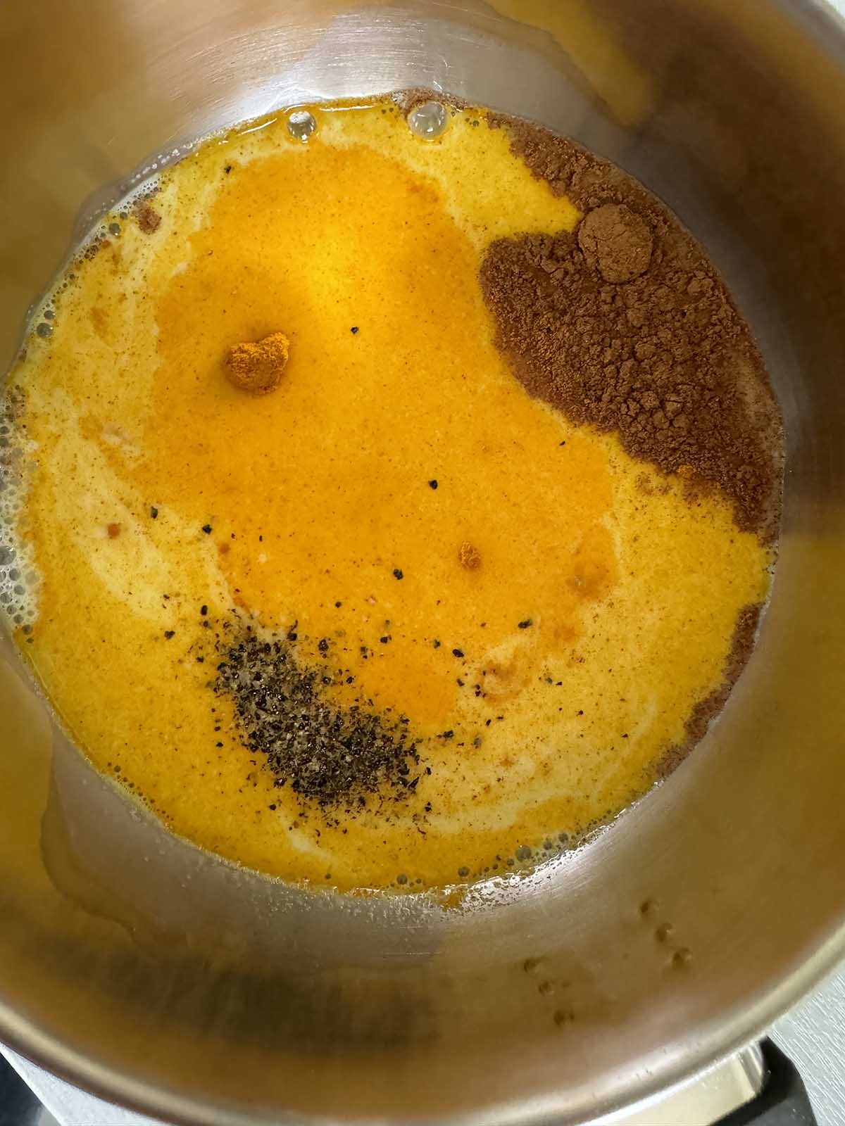 ingredients in a pot for golden milk chia pudding
