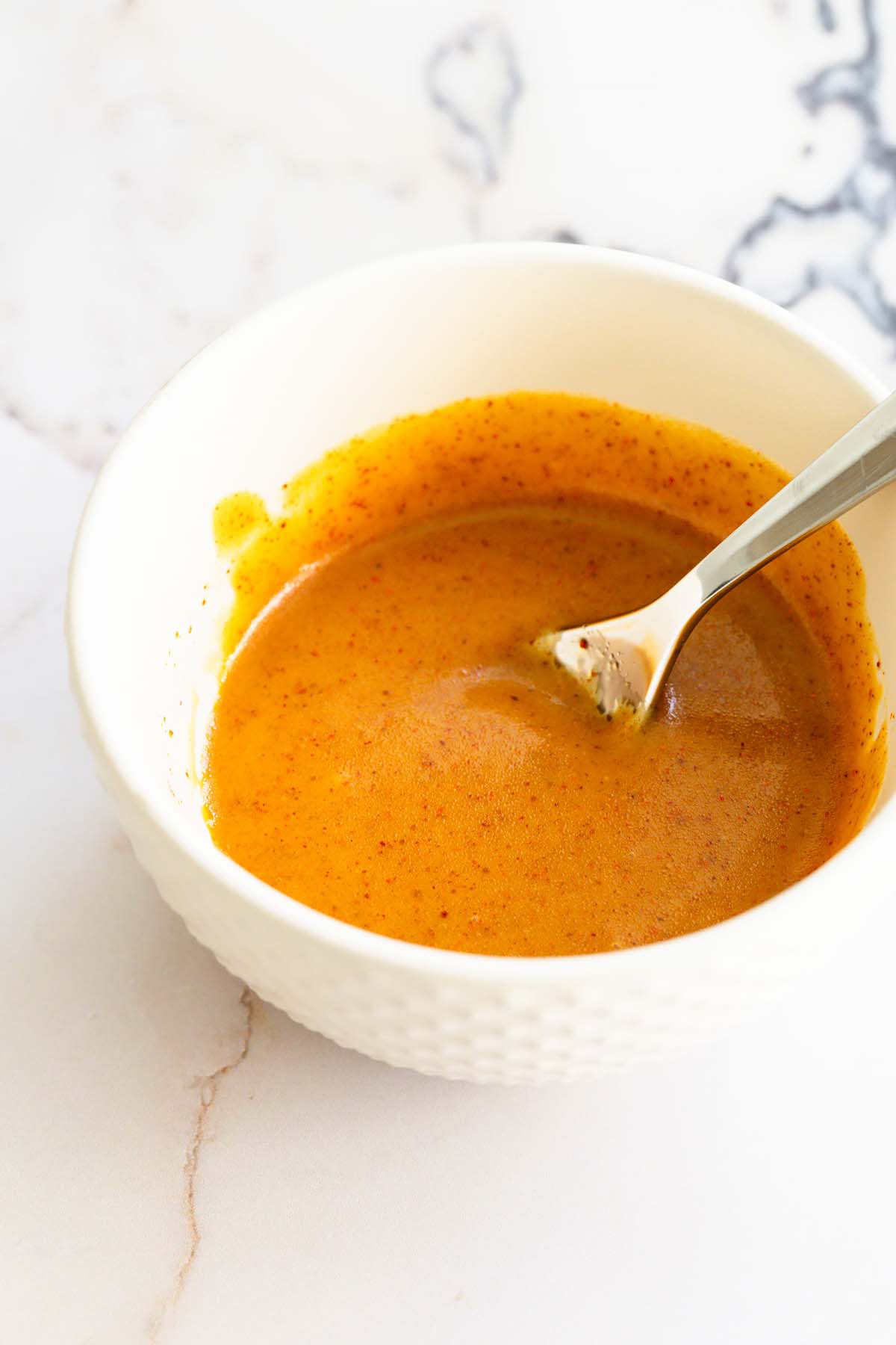 Honey dijon marinde in a bowl