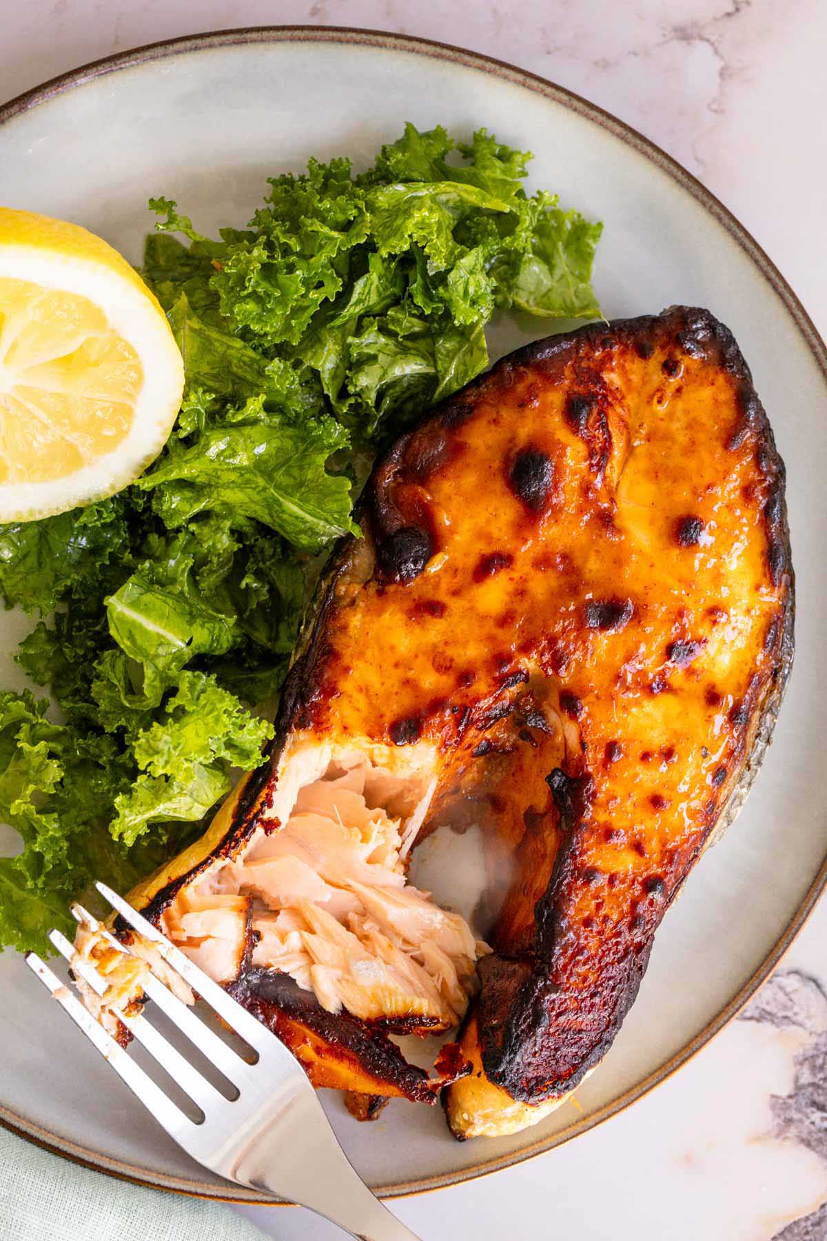 Air fryer salmon steak with kale salad on the side