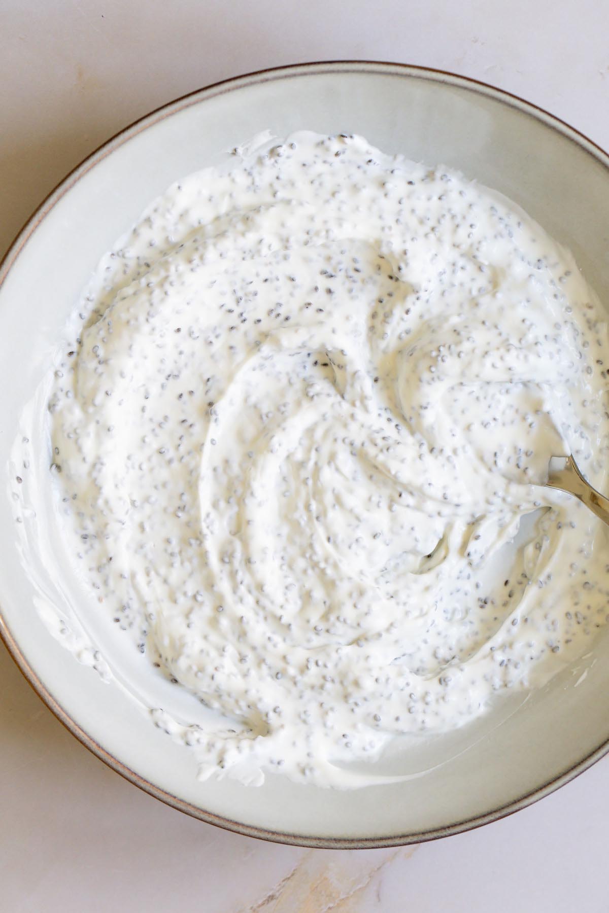 Mixing chia seeds into yogurt