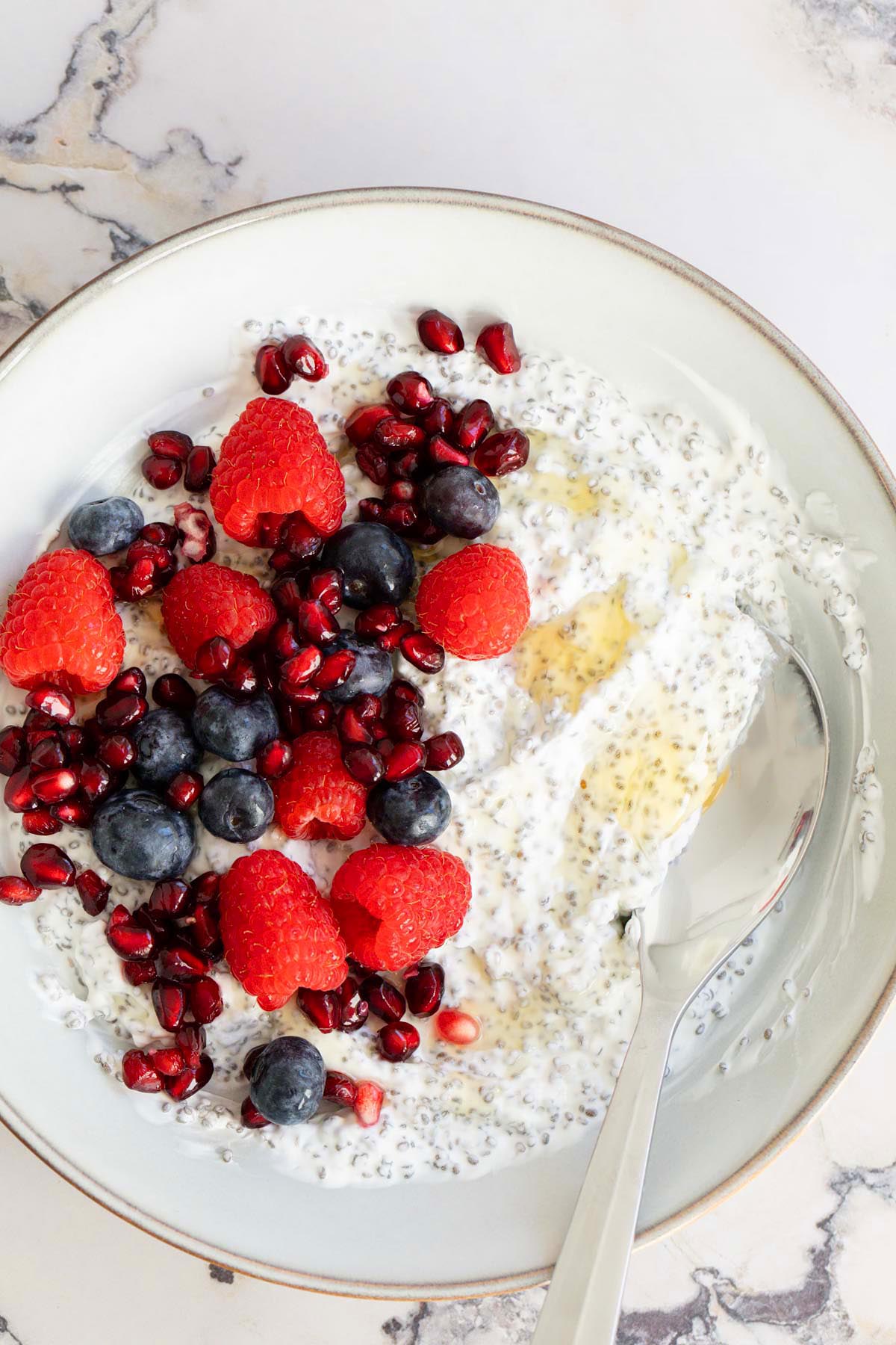 Yogurt chia pudding topped with fresh berries