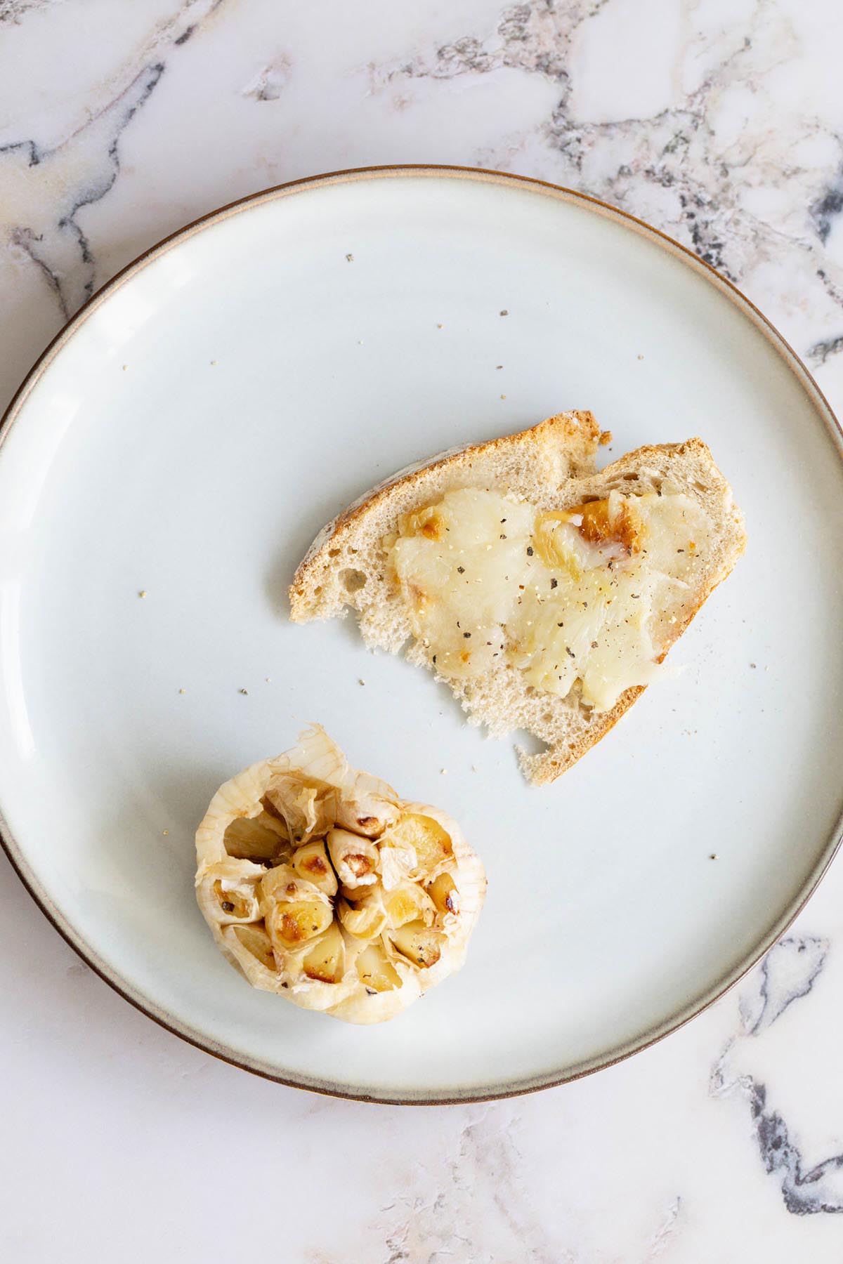 Roasted garlic spread on a piece of bread