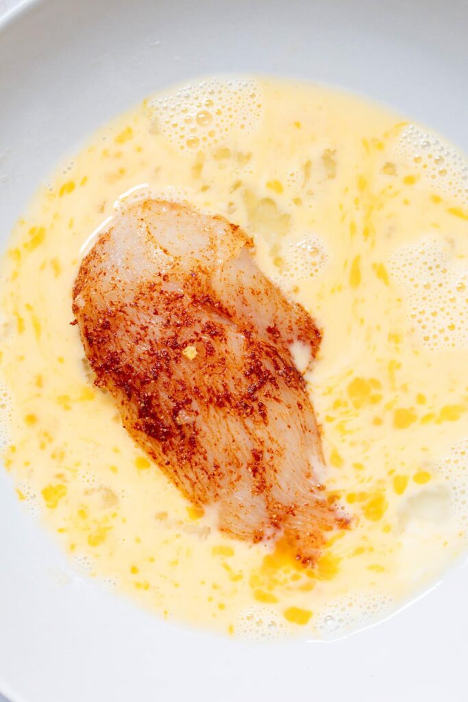 Chicken dipped in egg mixture