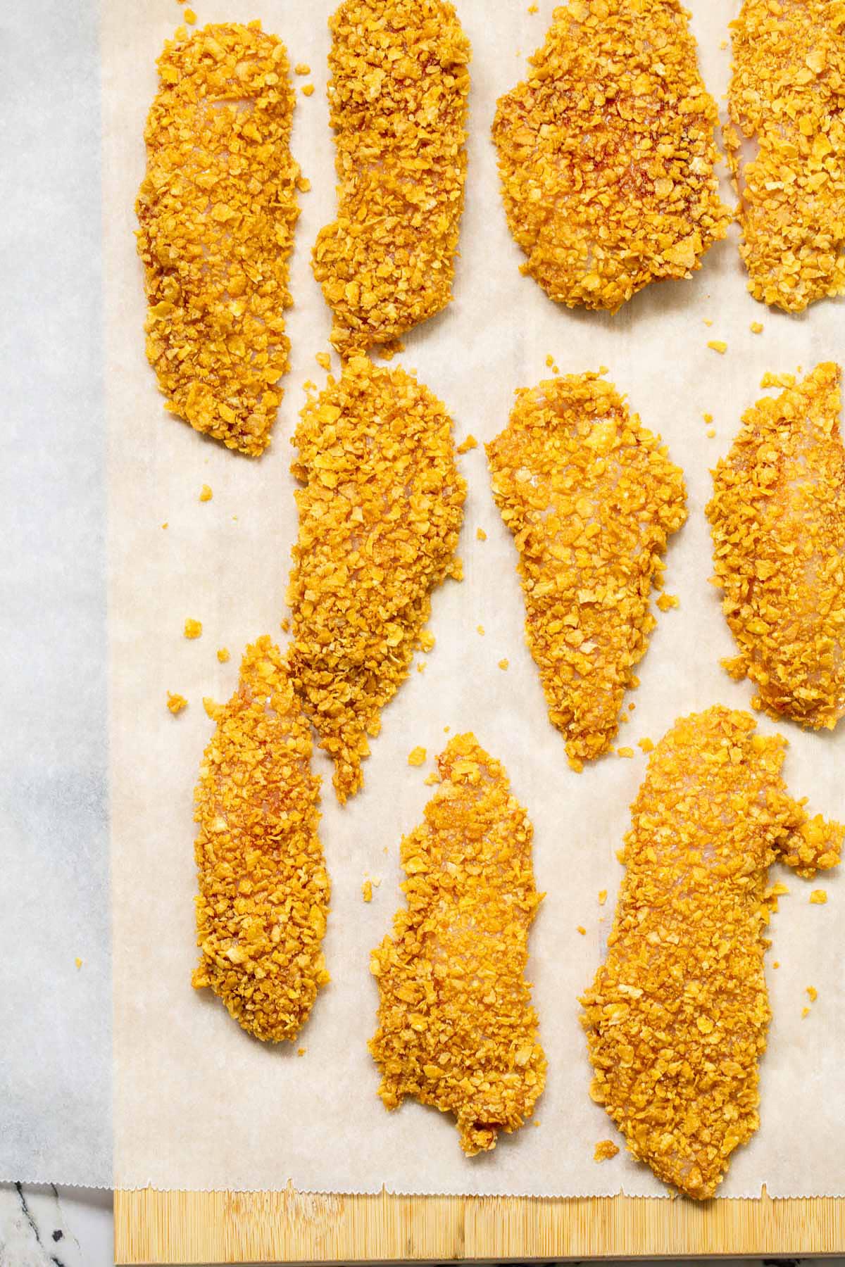 Air fryer cornflake chicken on a cutting board