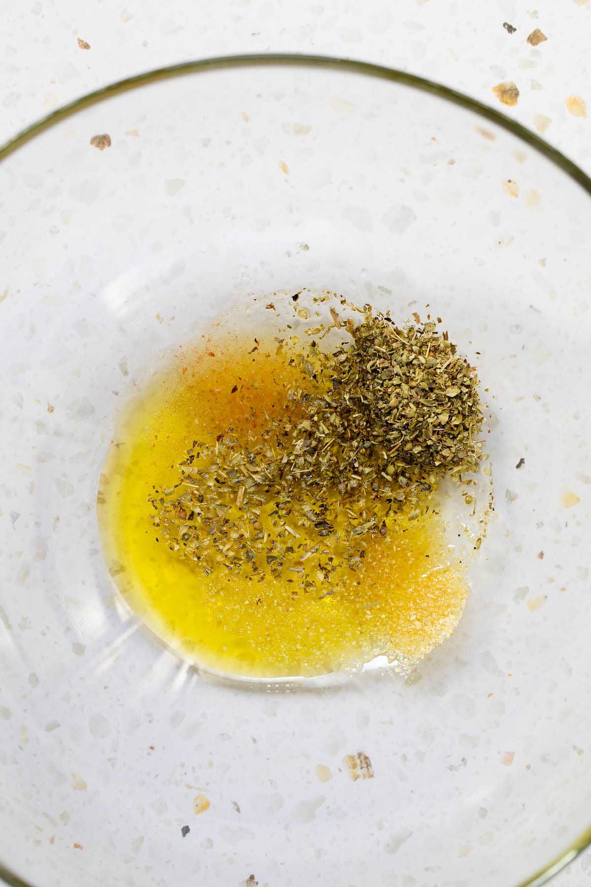 Seasonings and oil in a bowl
