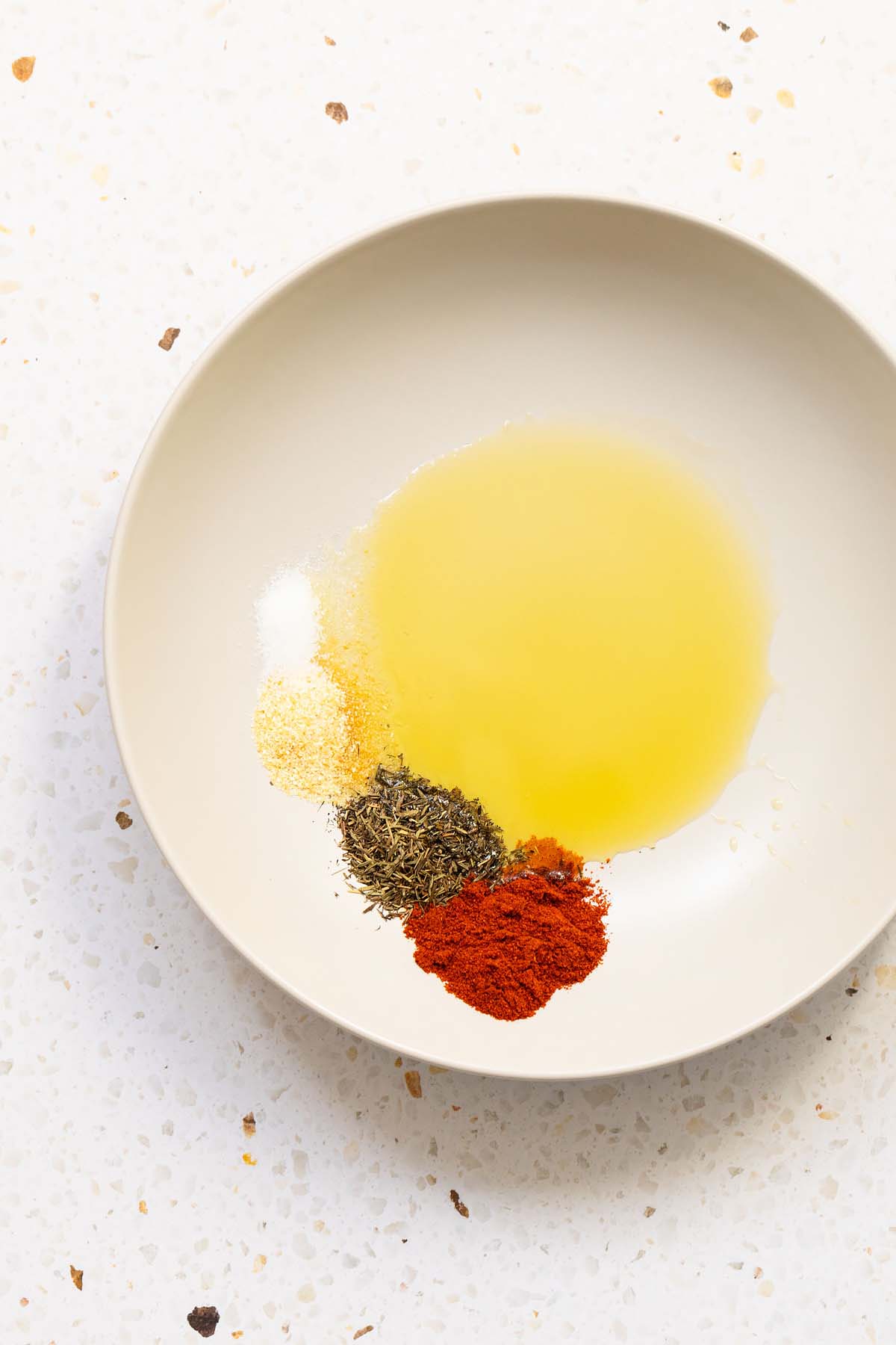 Spices and oil in a bowl