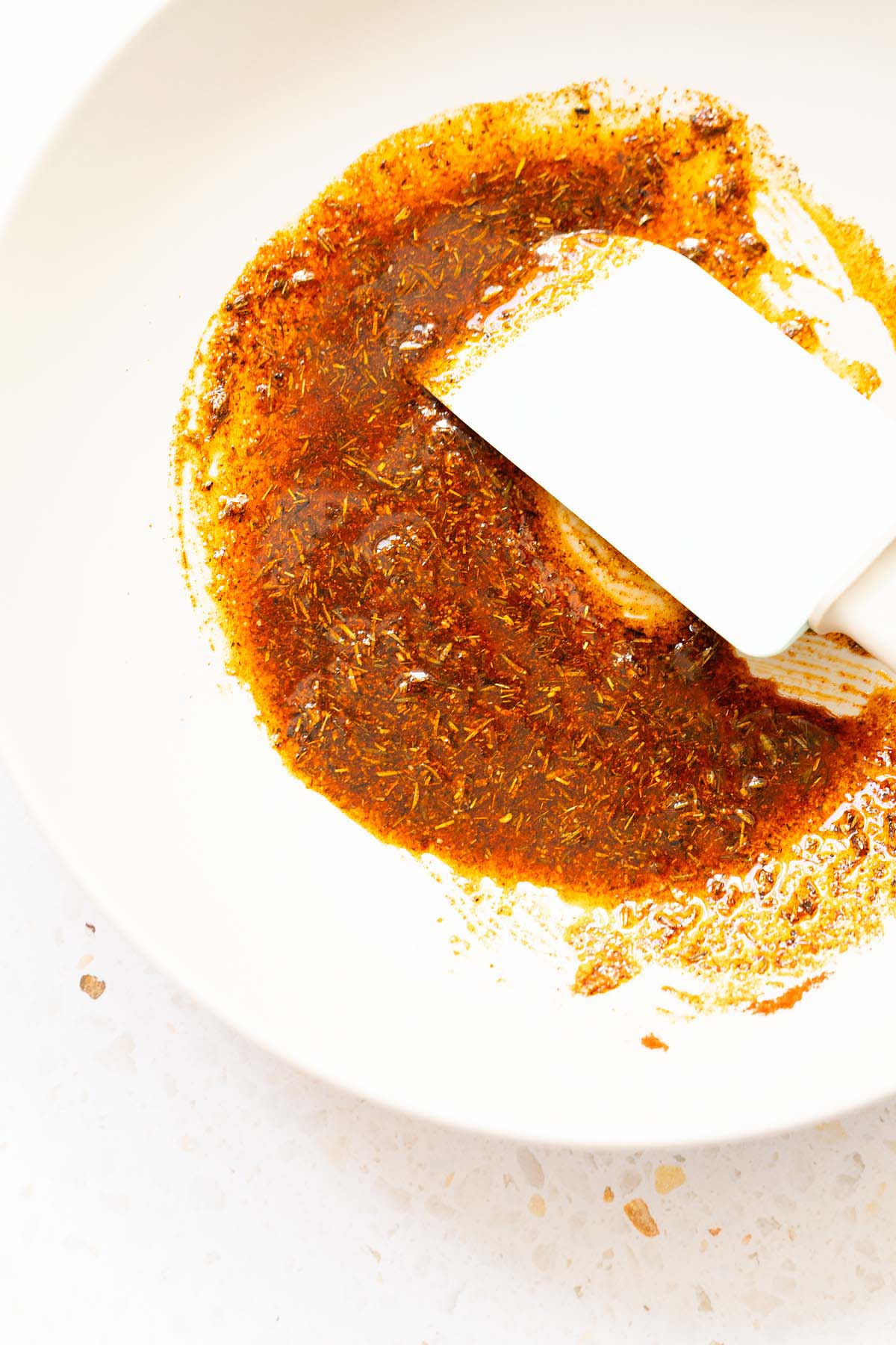 Spices and oil getting mixed together