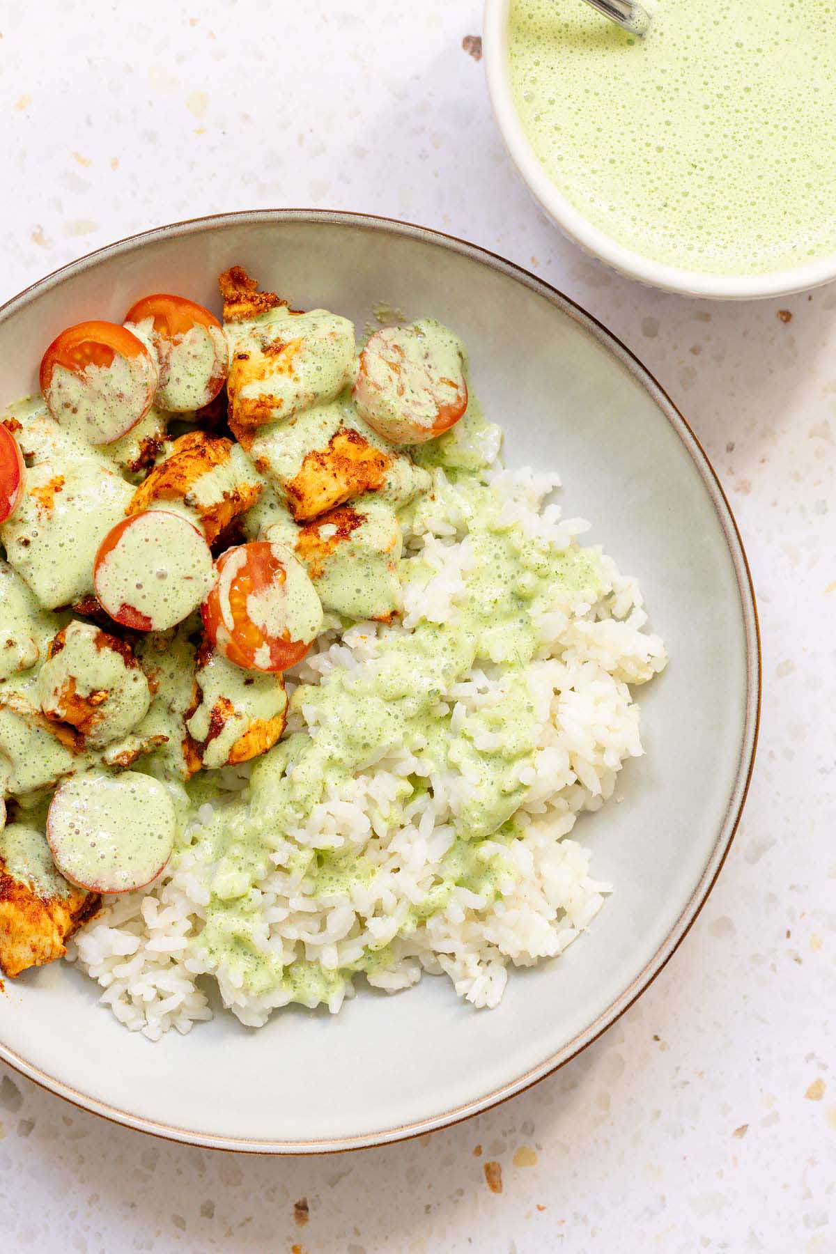 Yogurt mint sauce topping chicken and rice
