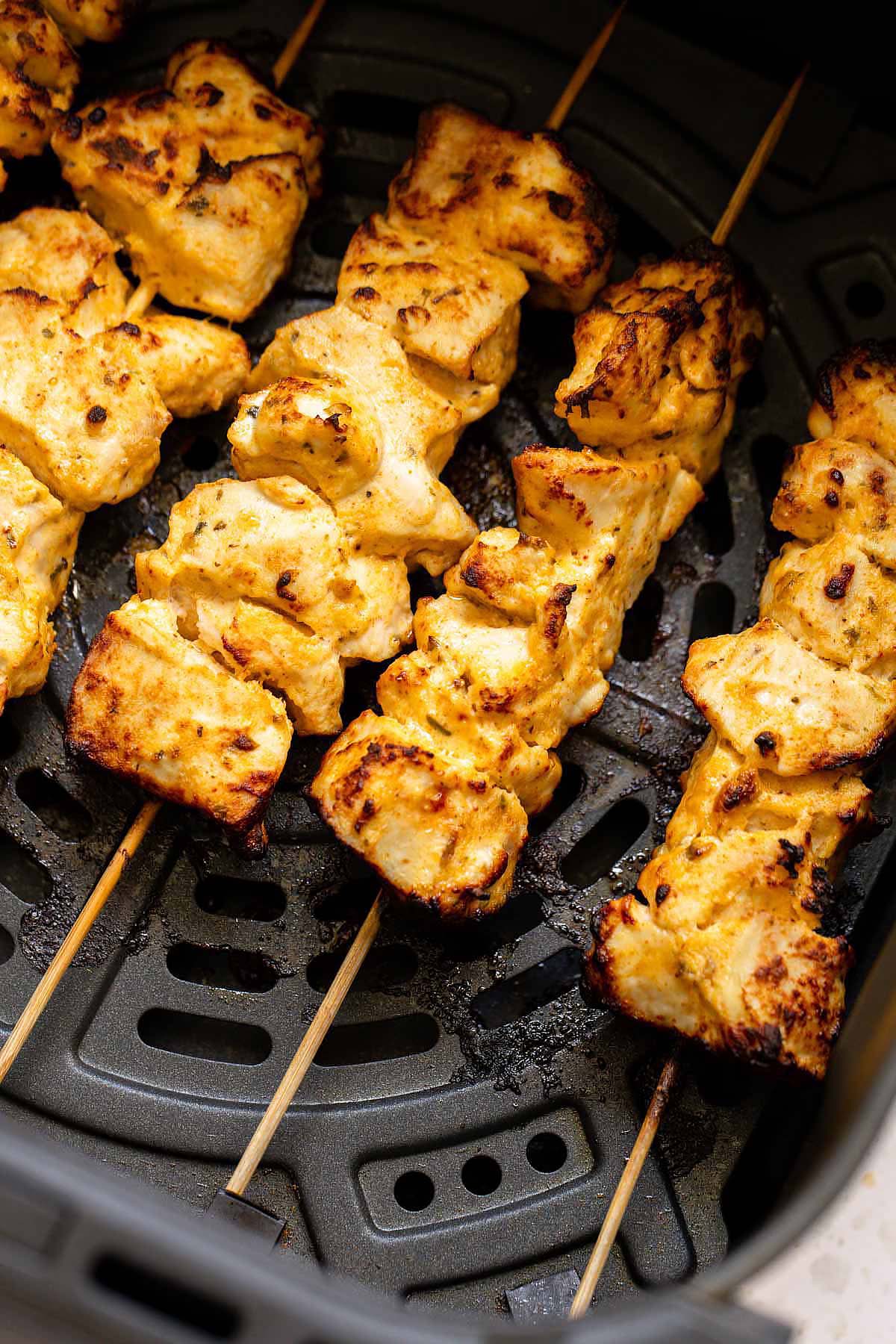 Chicken skewers in air fryer basket