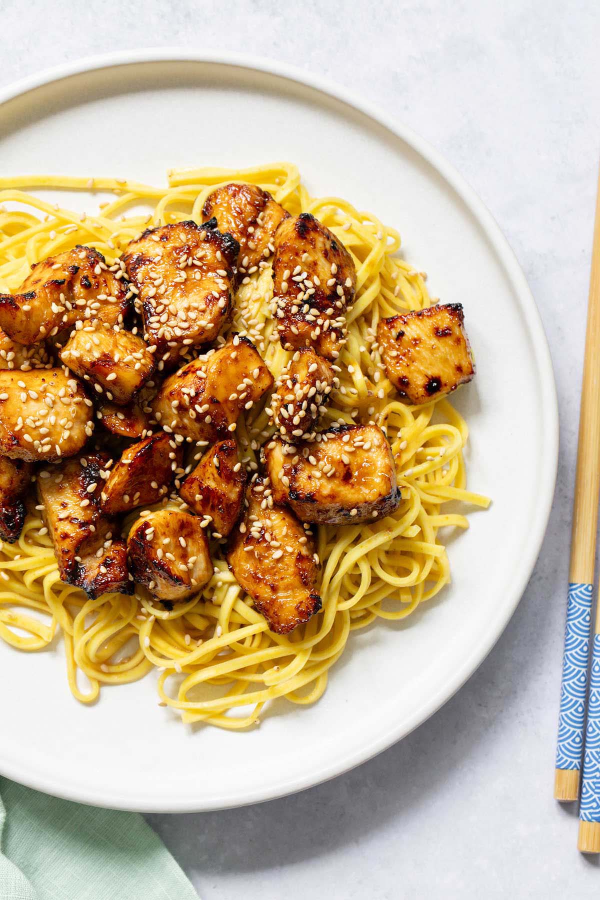 Air fryer hoisin chicken served over noodles