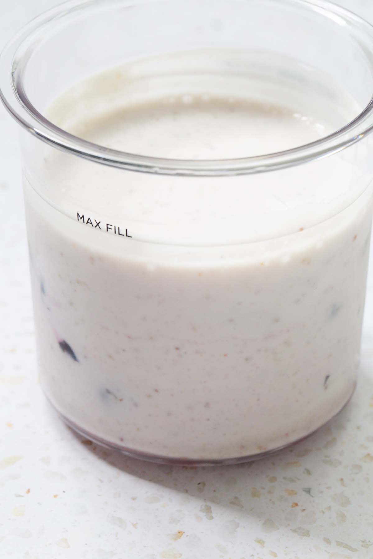 Yogurt and milk added to Creami container