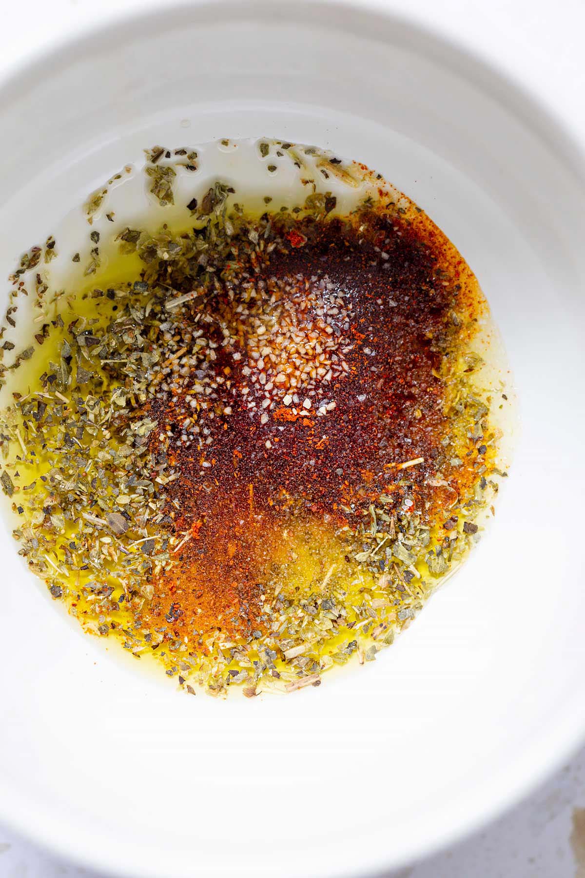 Oil and seasonings in a bowl