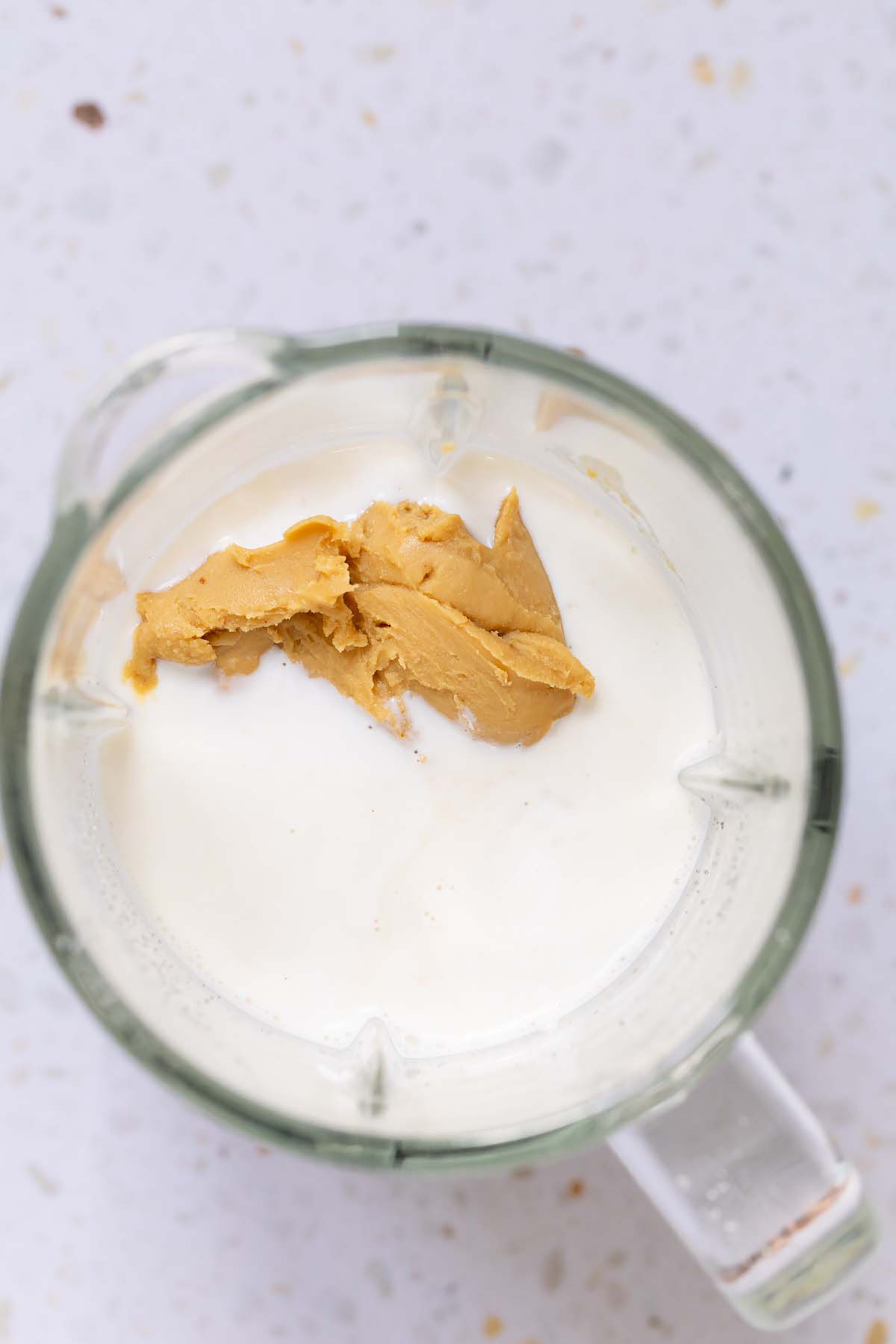 Peanut butter and other ingredients in blender canister
